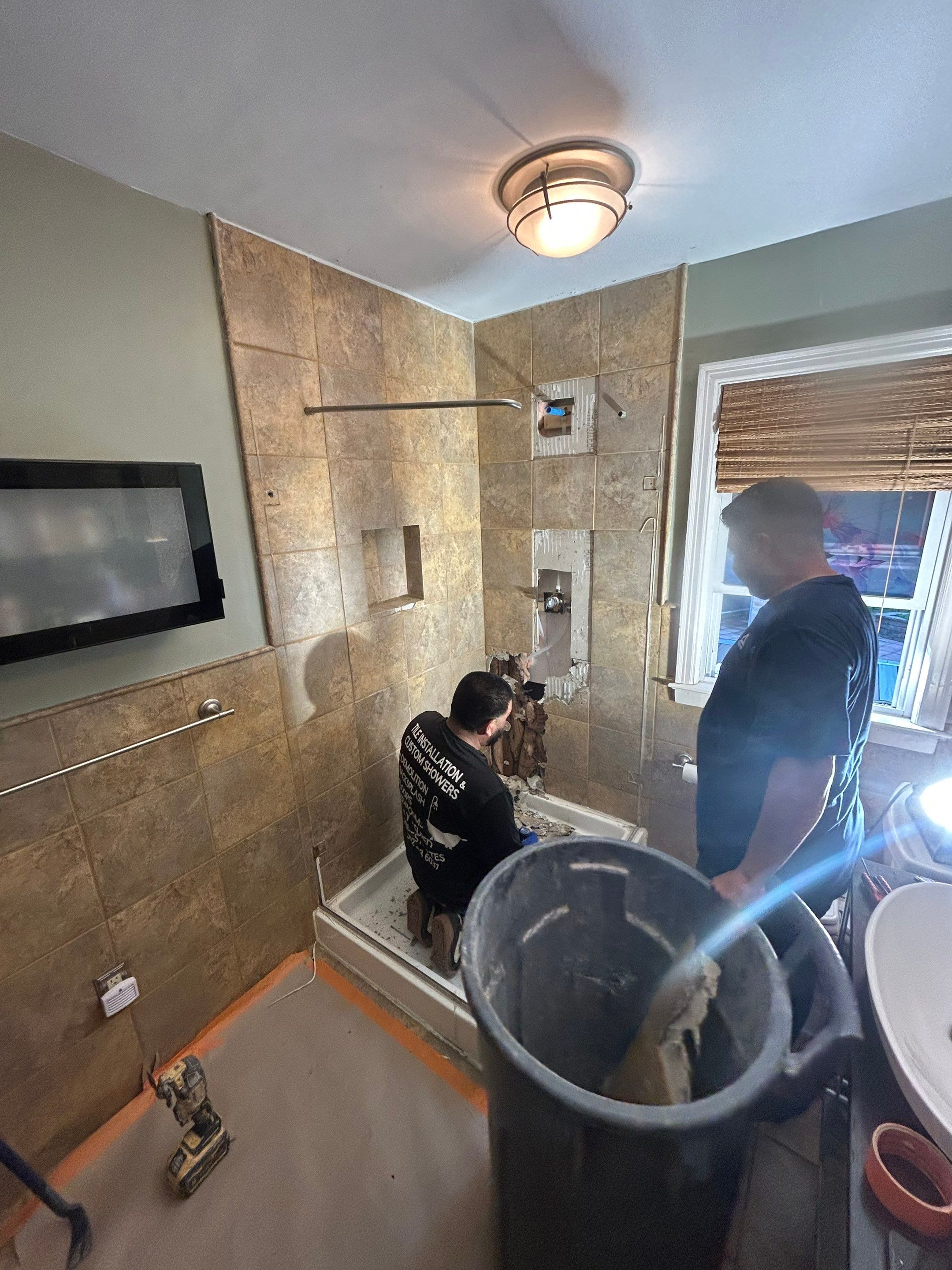 Natural Stone Shower Remodel and Pebble Floor Installation in Louisville by Footprints Floors Kentucky