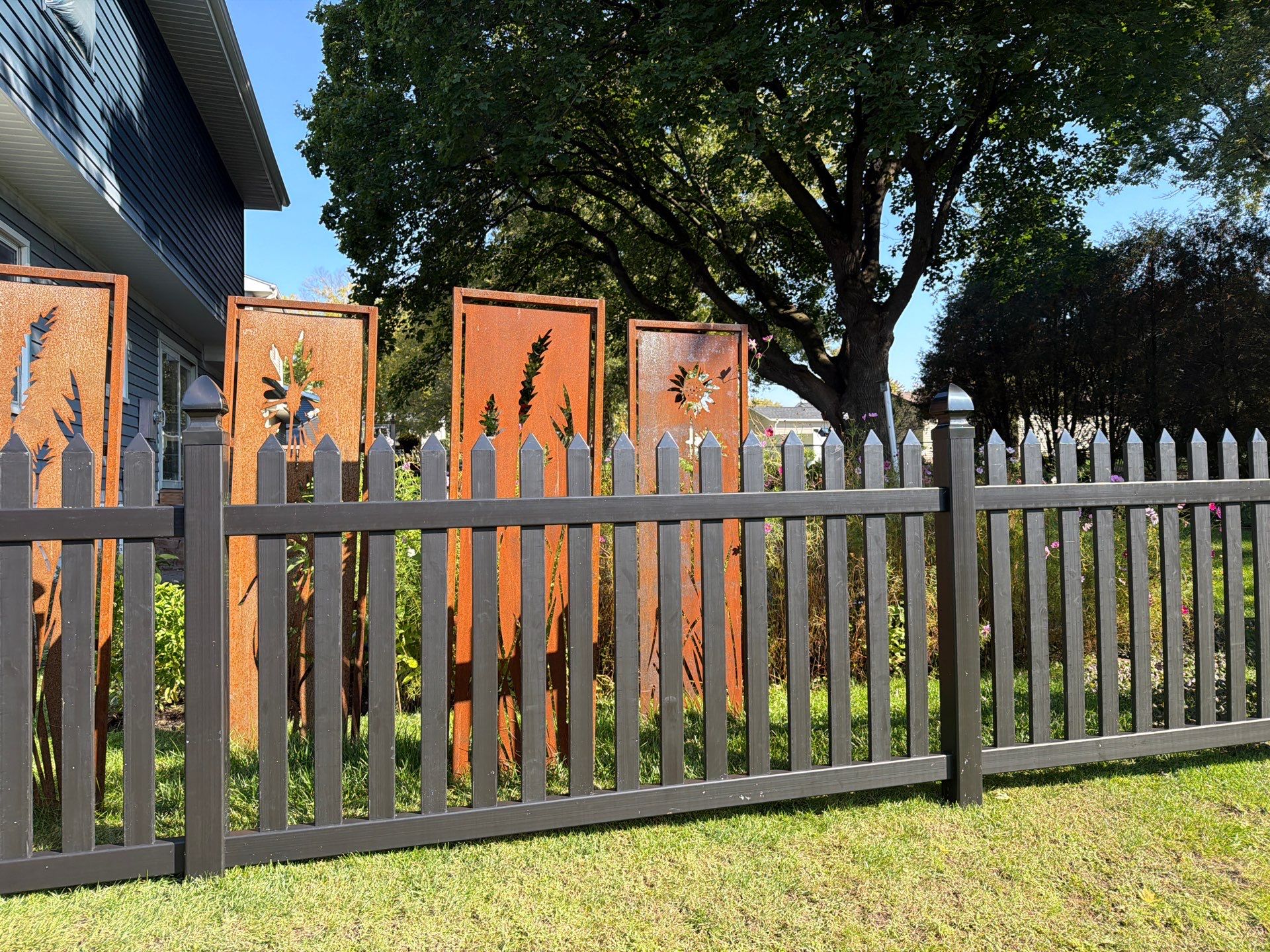 Black Vinyl Spaced Picket Fence Installation in Cedar Falls by Perfect Picket Fence and Stain
