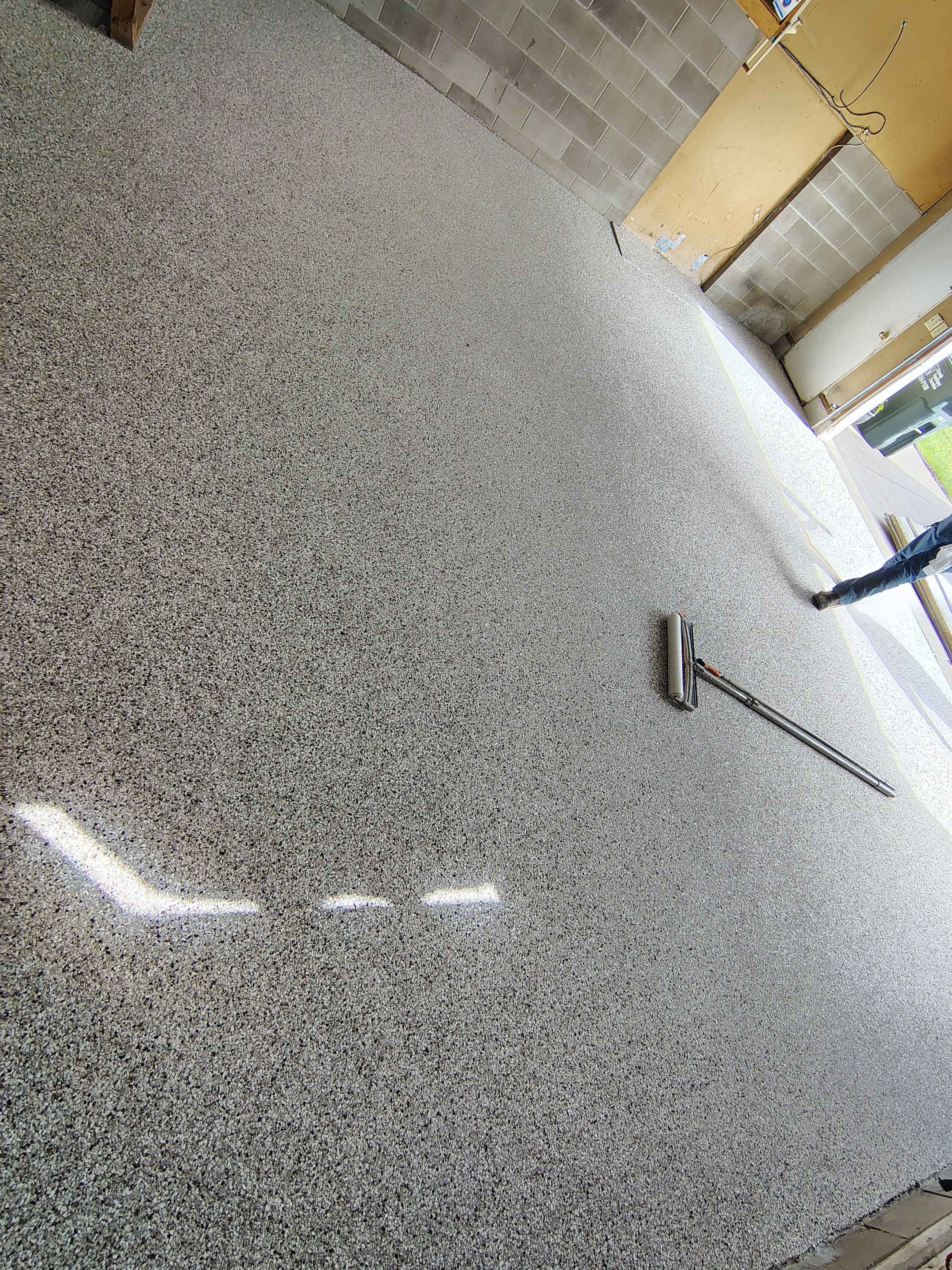 Sioux Falls Garage Epoxy Floor Installation and Concrete Crack Repair by Select Painting, Coatings & Garage Cabinets