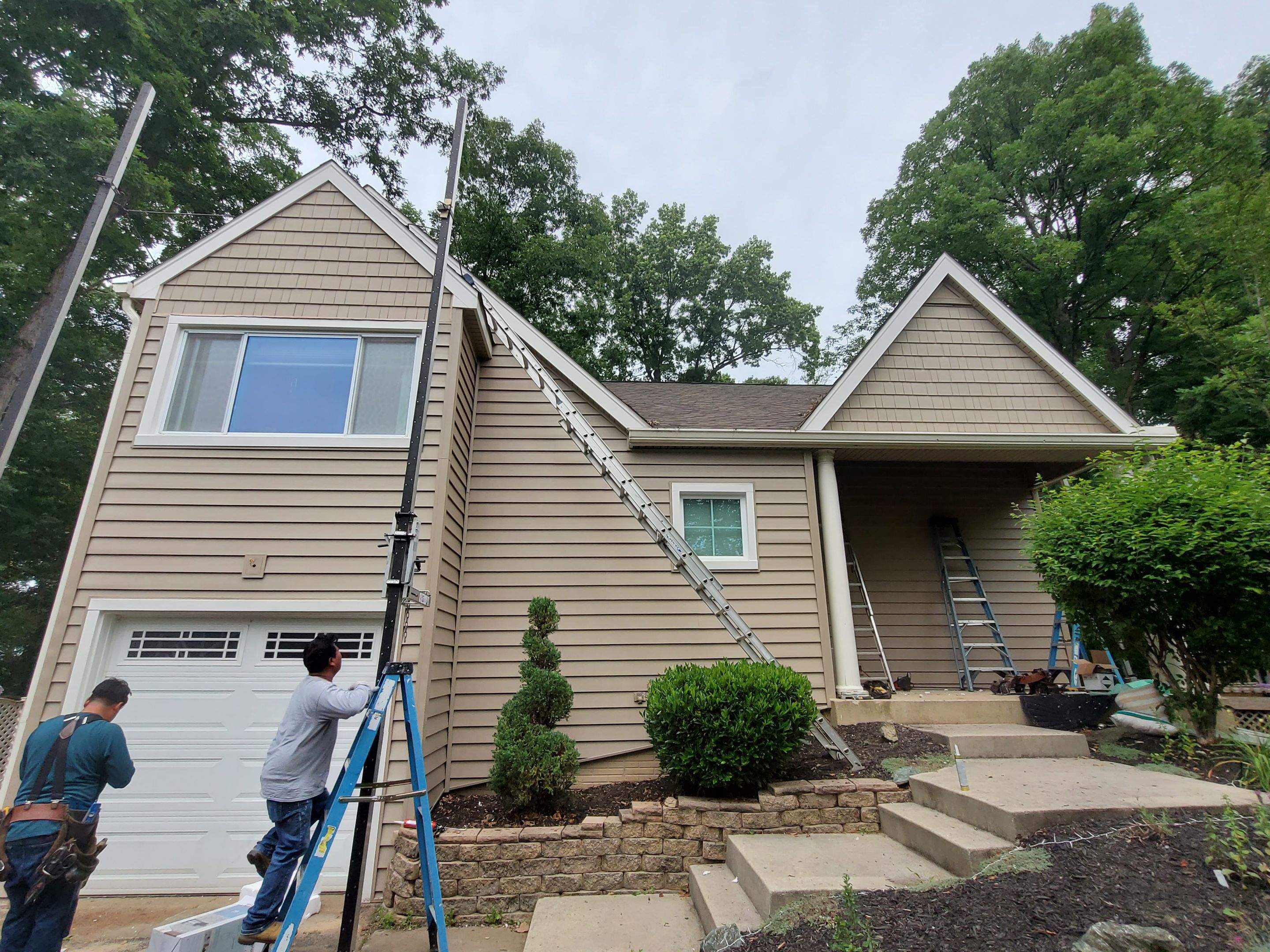 Mastic Siding + Interstate Windows by American Home Contractors