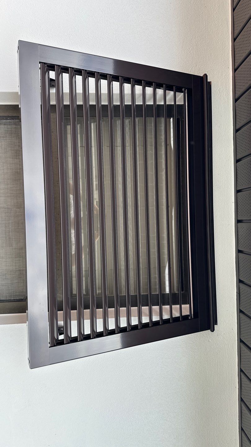 Bahama Shutters in Grey Brown by Smart Guard Shutters
