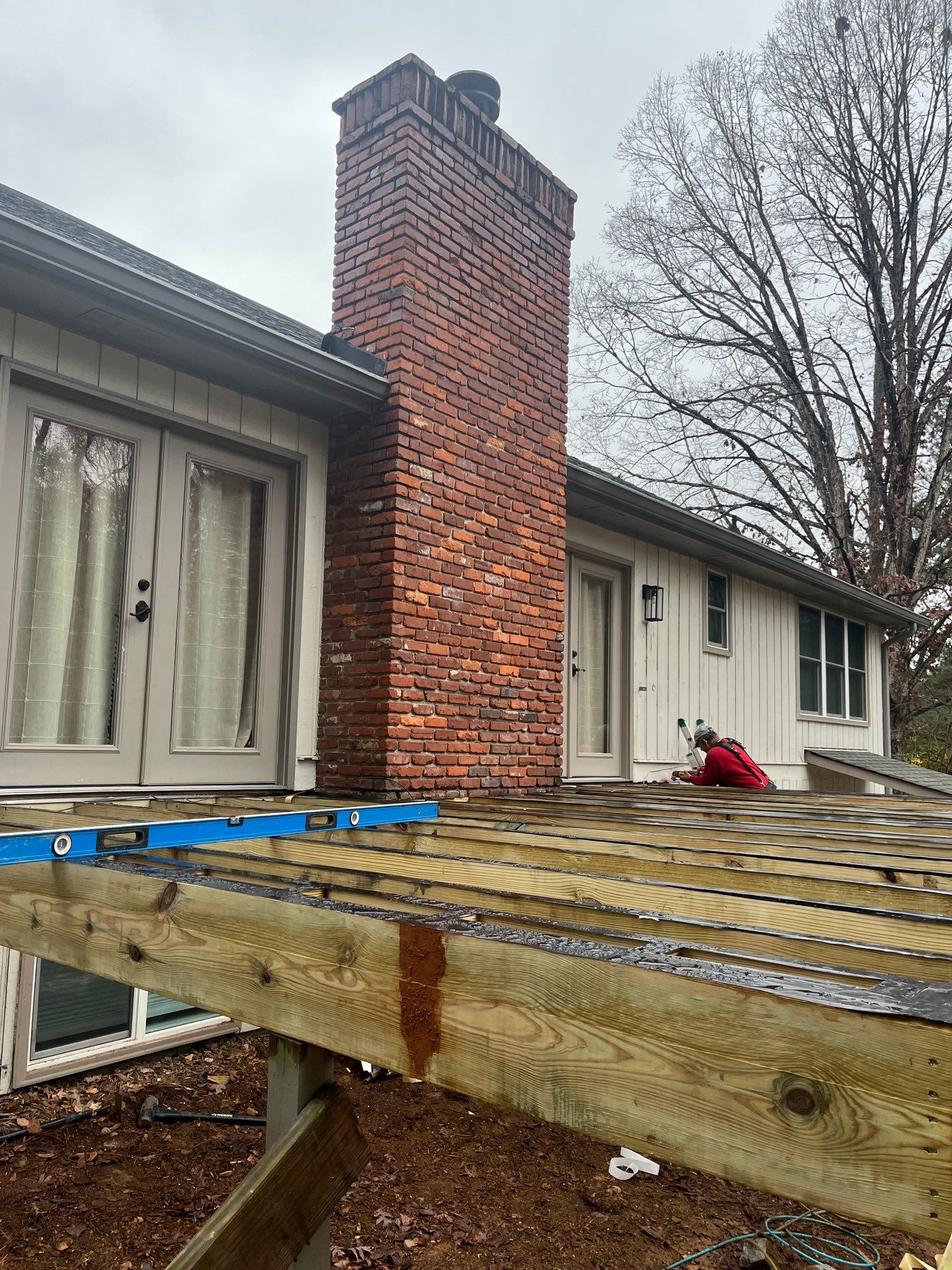 Deck and Shed Roof Style Covered Build using Trex Decking Products by Nelson Exteriors 
