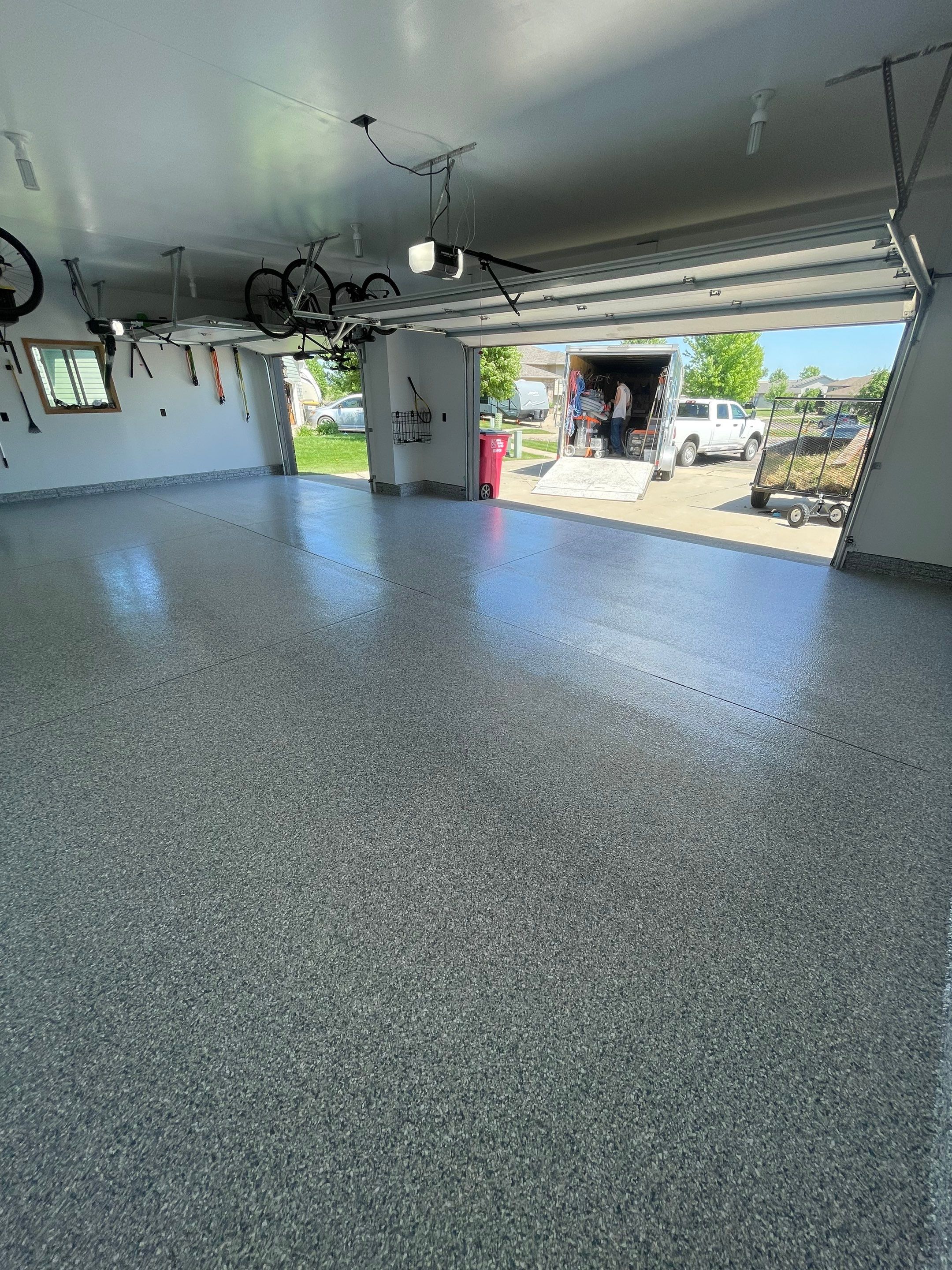 Tidal Wave Flake Garage Floor Installation in Sioux Falls by Select Painting, Coatings & Garage Cabinets