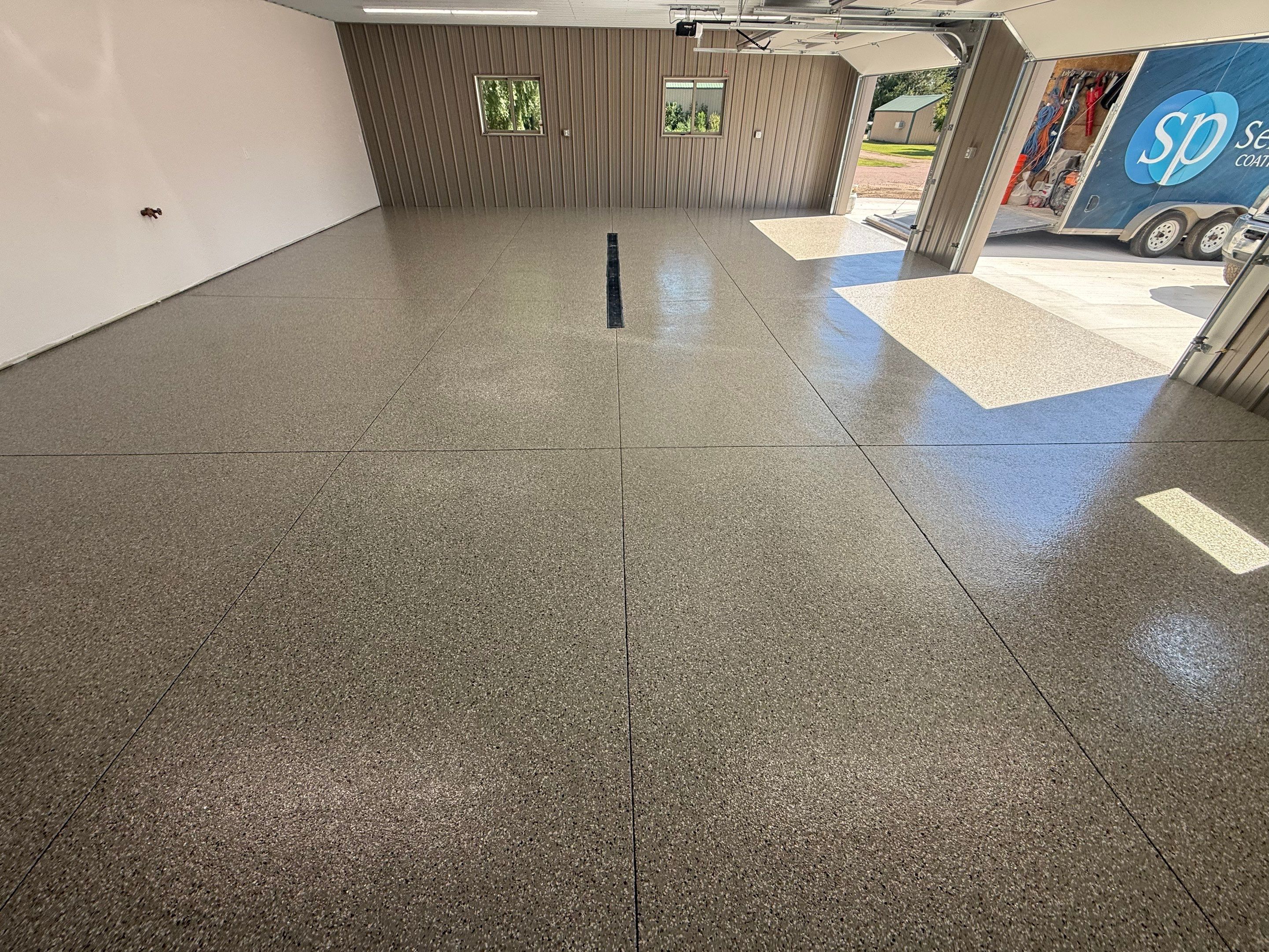 Creekbed Flake Coating in Woonsocket, SD by Select Painting, Coatings & Garage Cabinets