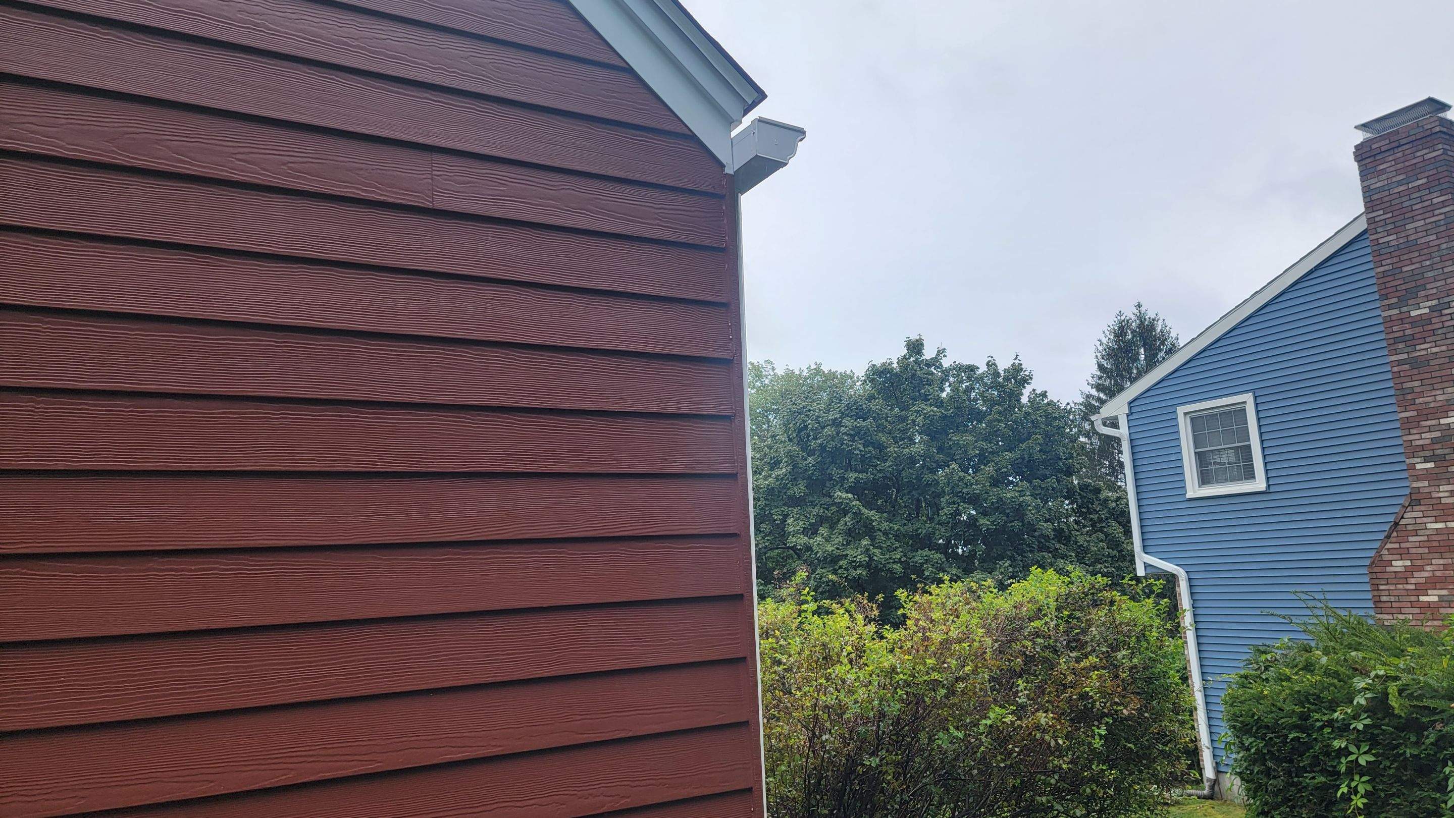 Siding Installation using James Hardie Countrylane red by UBrothers Construction