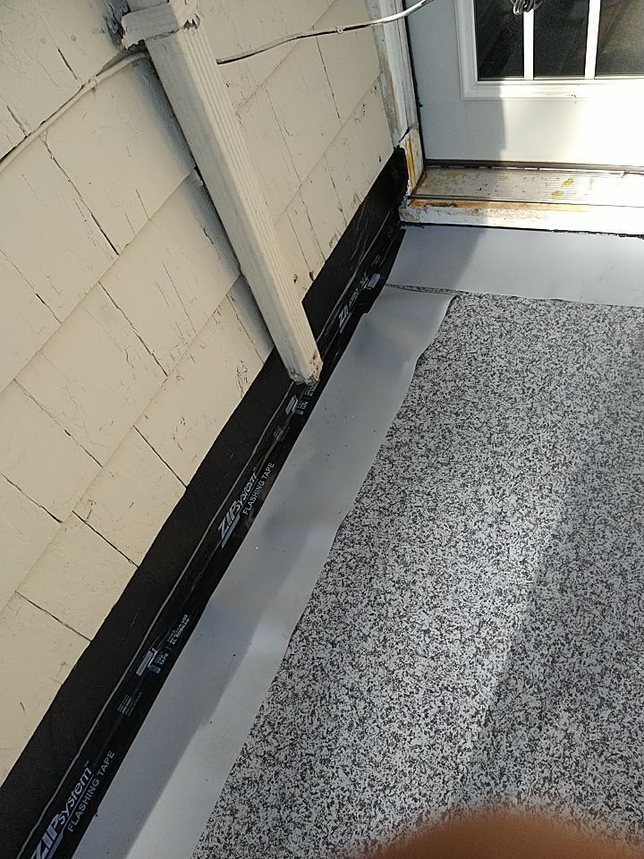 Residential Roofing Installation, Dec-tek walk-out porch roof, siding on garage by Absolute Roofing and Construction