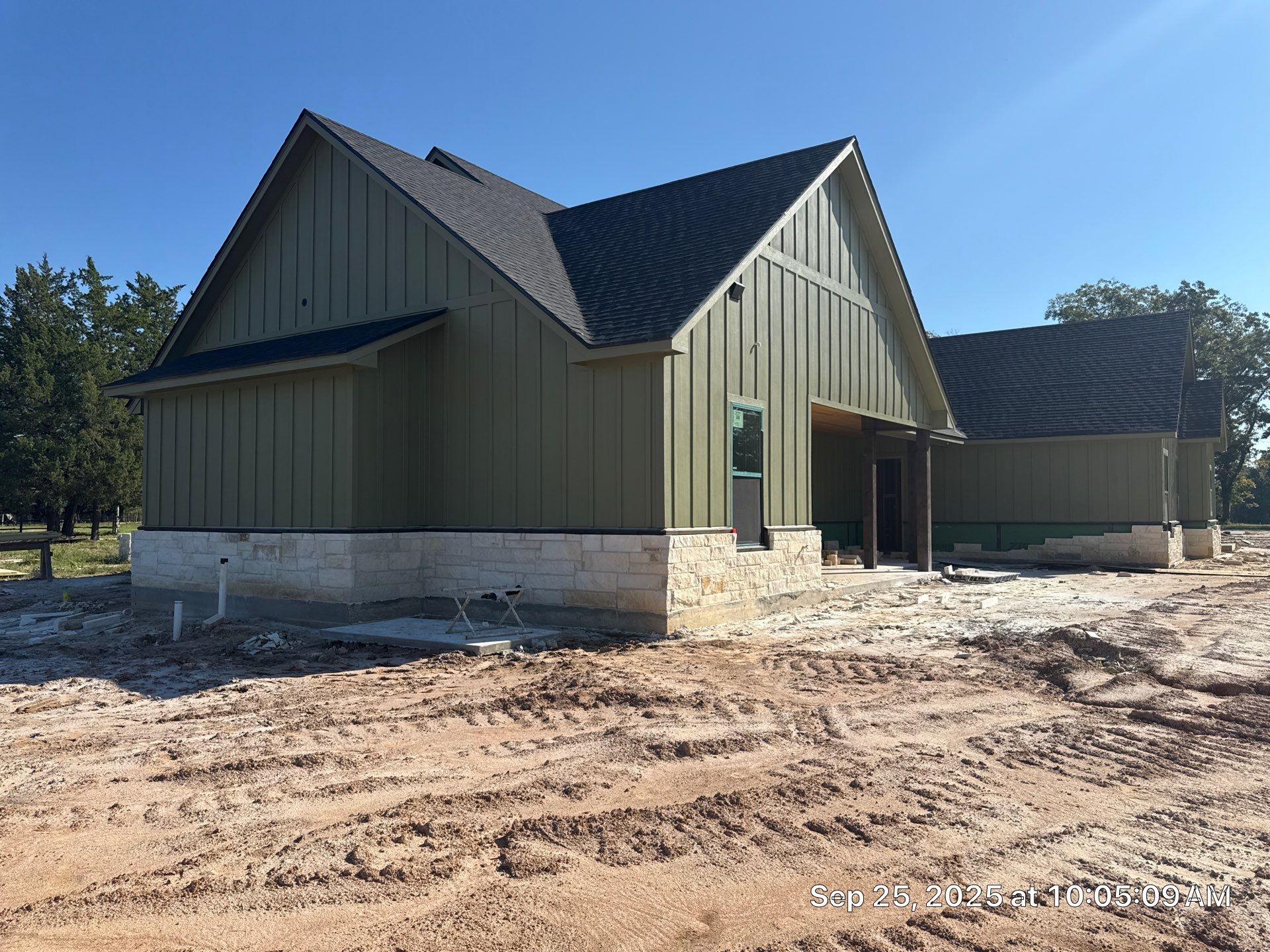 Cleveland Ranch Charm: Natural Stone Wainscot with Green Accent Siding. by Apex Conventional Stucco Llc