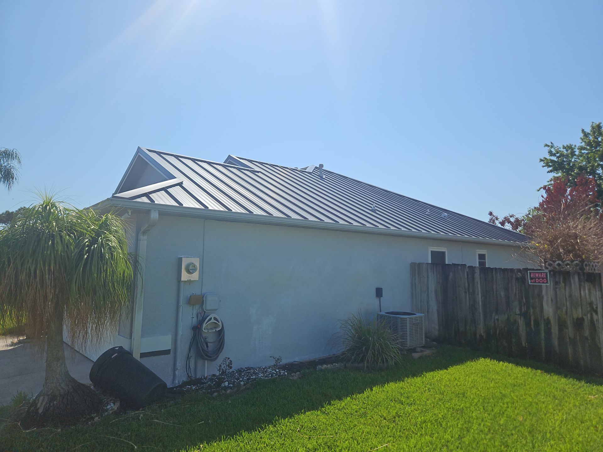 Complete Metal Roof Replacement and Seamless Gutter Installation in Melbourne by Wiedmann Construction & Roofing