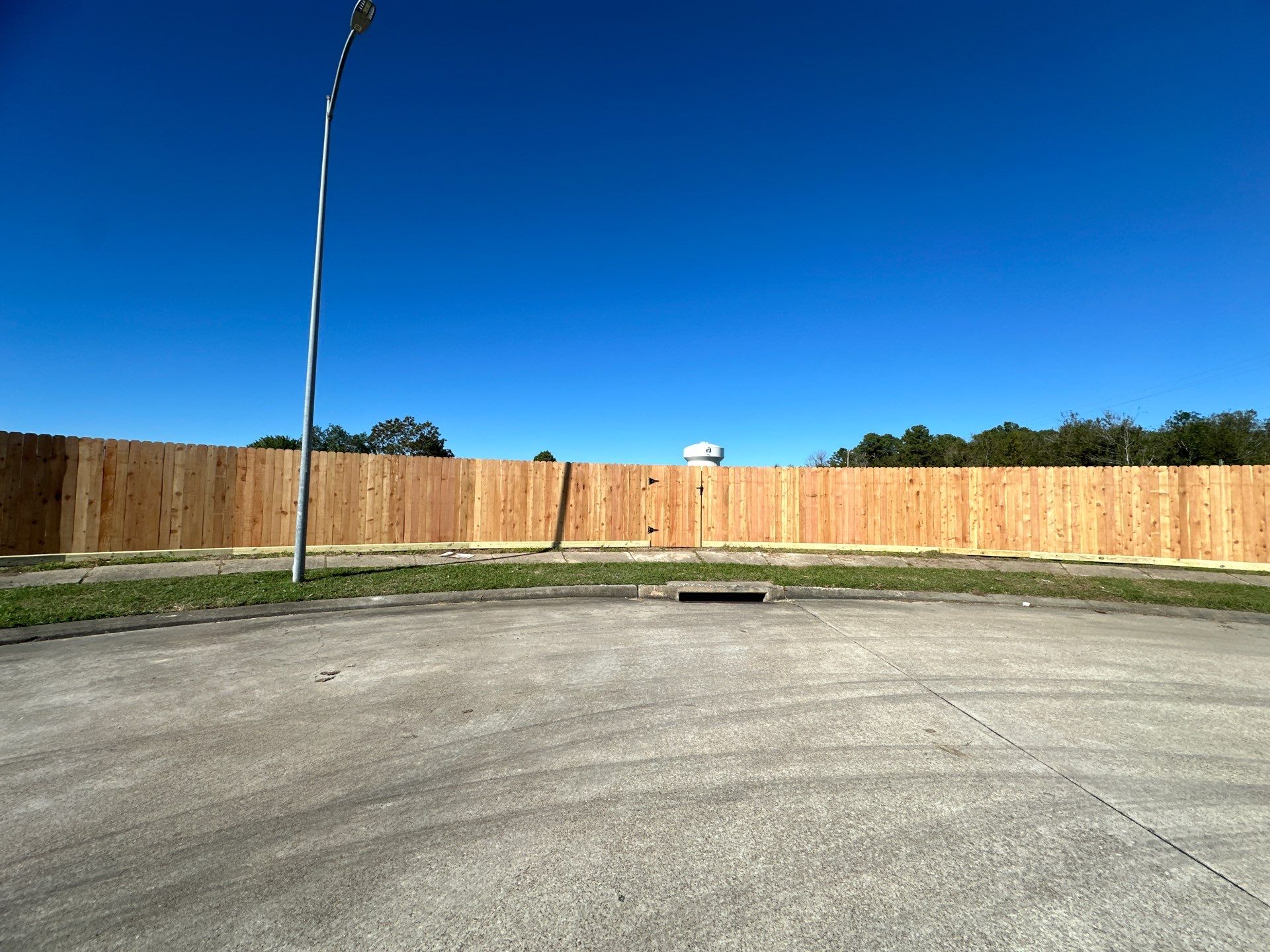 Premium Commercial Fence Installation with Western Red Cedar Pickets, 3 Rails, and Deluxe Wood Gates" by Tim's Fences