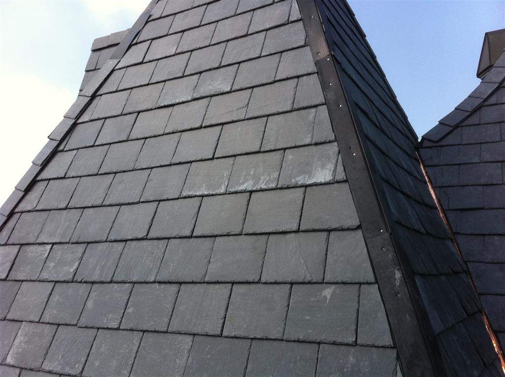 Historic Building ROOF REPLACEMNT with GAF TruSlate  on steep slop and Versico 60mil TPO on flat roof by Gorilla Exteriors Contracting, LLC