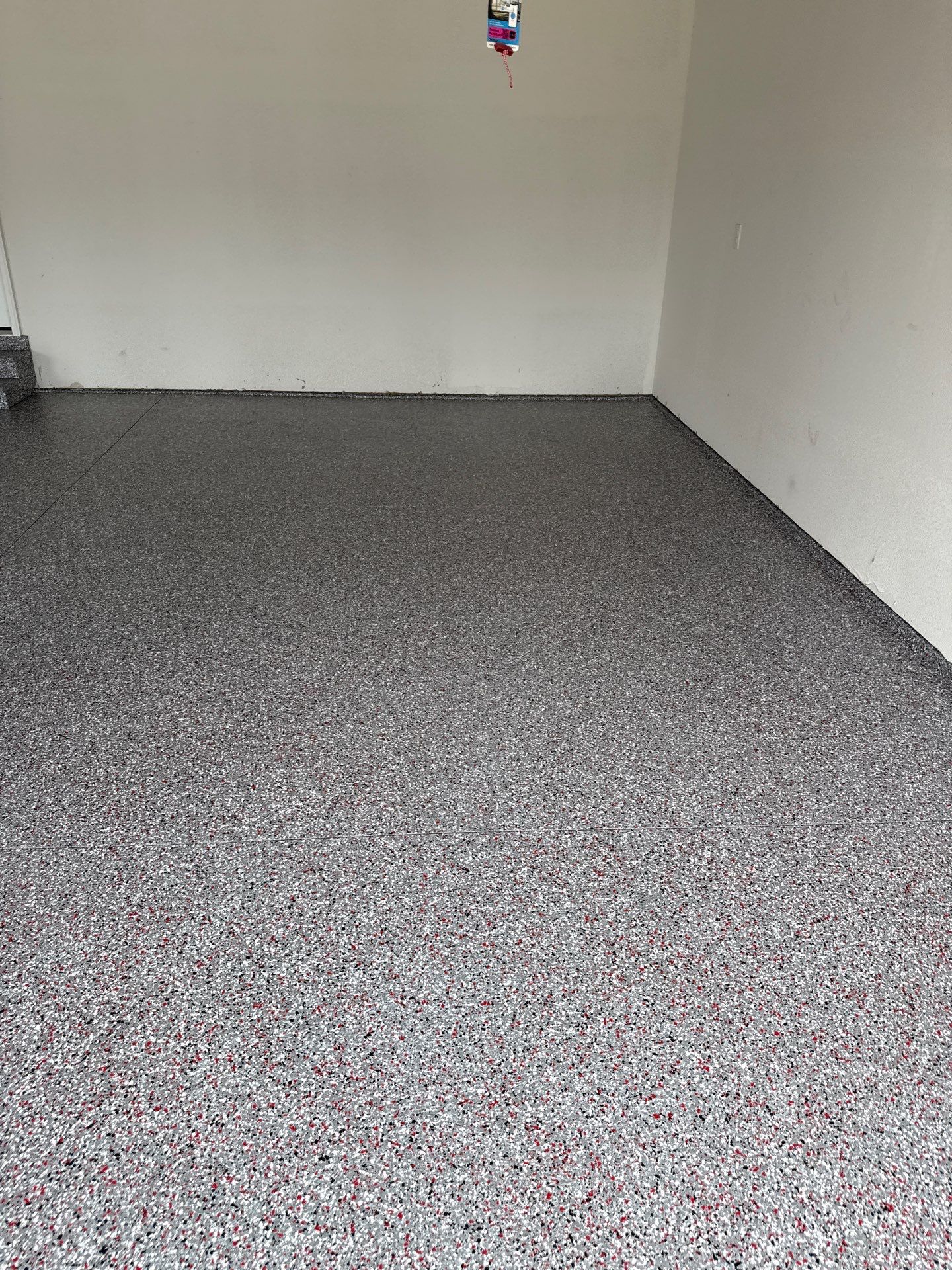 Custom Flake Garage Floor Coating Installation in Altoona by Revival Concrete Coatings