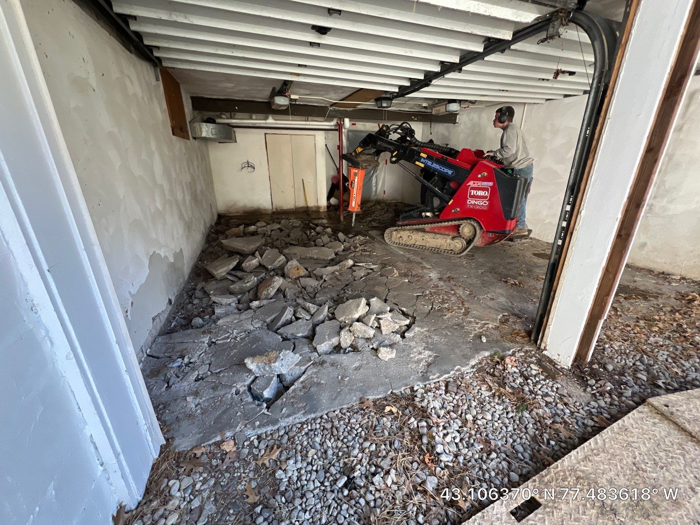 Concrete garage floor replacement with a broom finished apron and wall repair by NG Masonry & Construction LLC