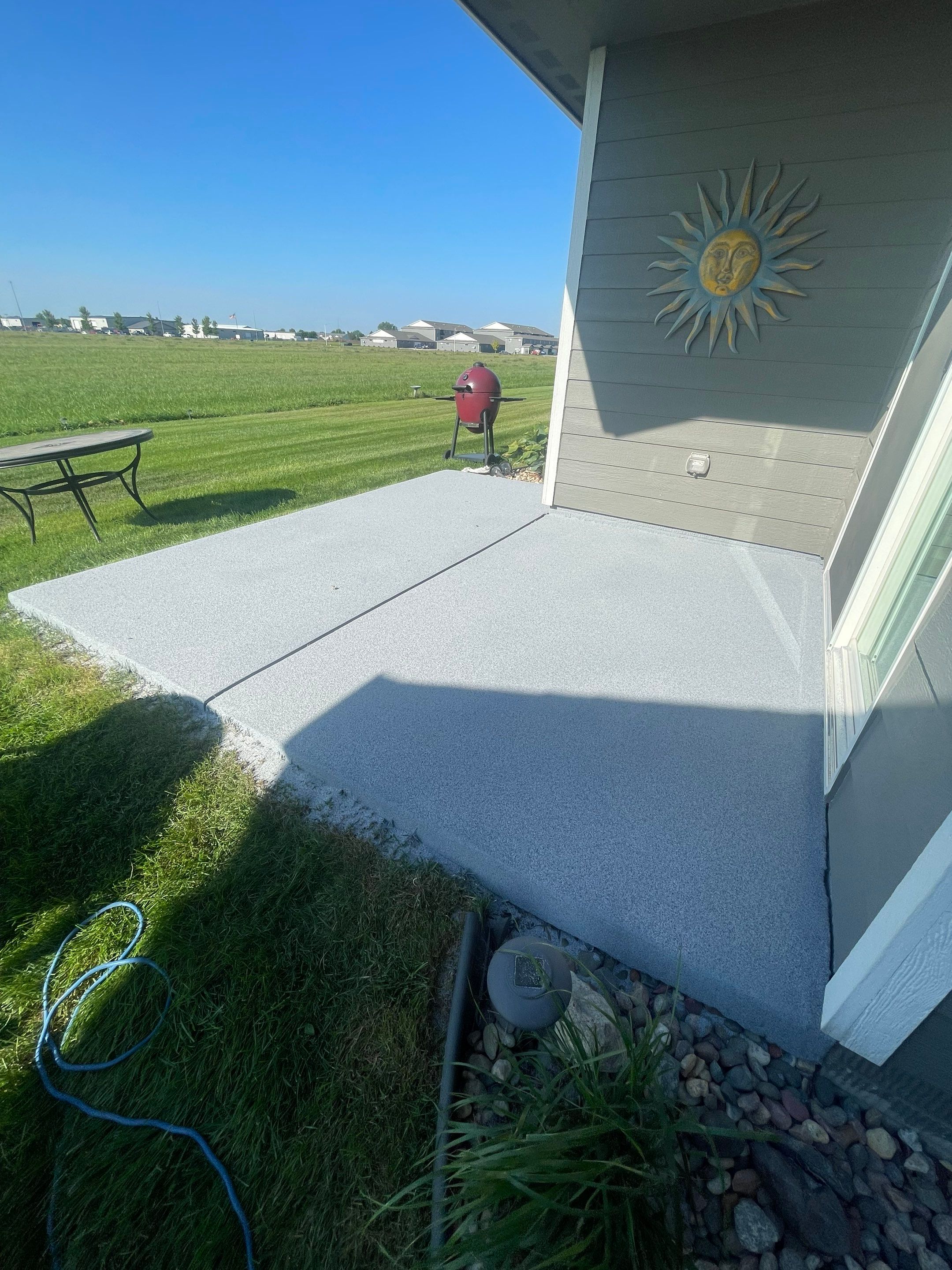Starry Evening Concrete Patio Coating Installation in Tea by Select Painting, Coatings & Garage Cabinets