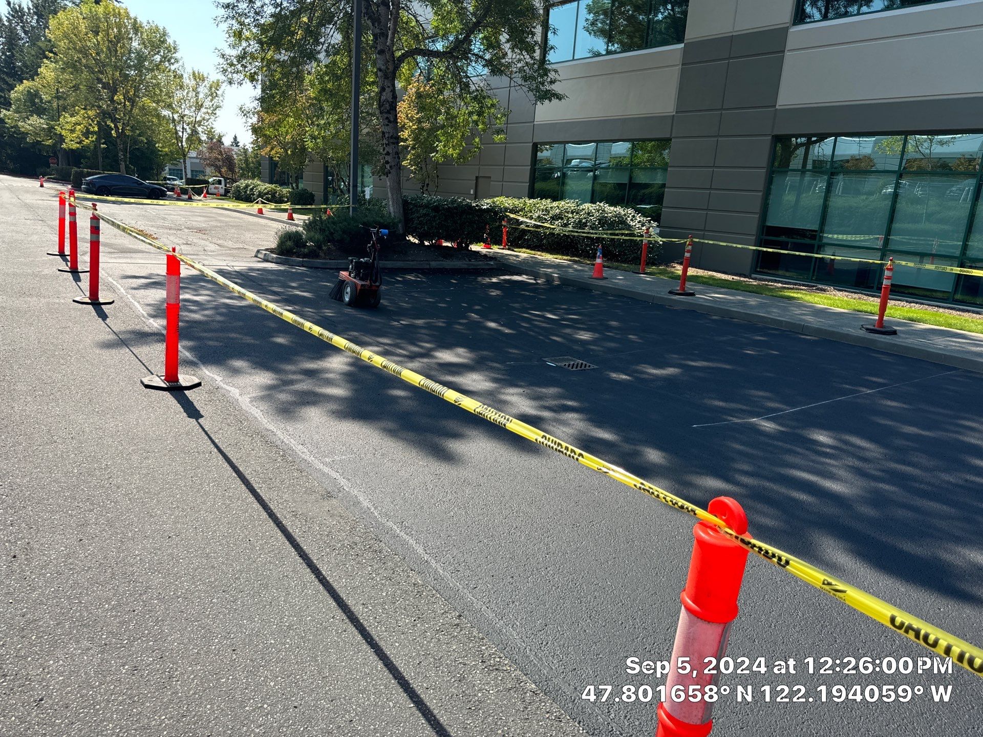 Kidder Matthews | Parking Lot Sealcoating & Striping with Concrete Curb & Patch Repairs  by Jireh Asphalt & Concrete Inc 
