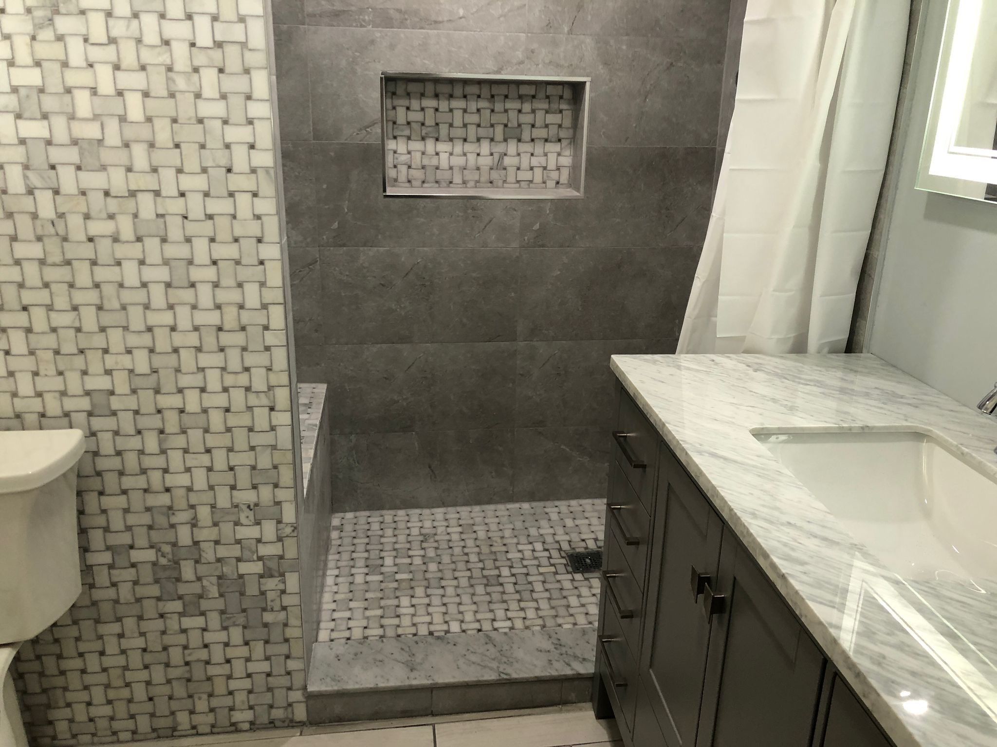 Bathroom Remodel using Tile by Home Concepts Construction