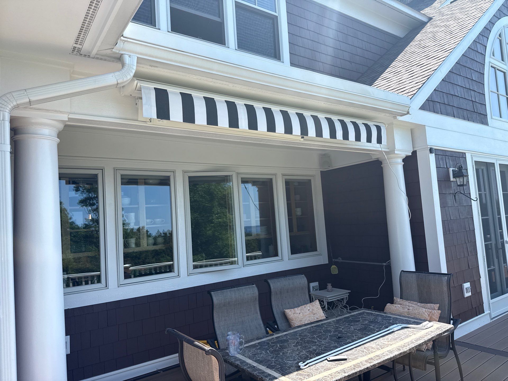 Sunesta Retractable Awning Installation in Harbor Springs by Rainbow Seamless Systems