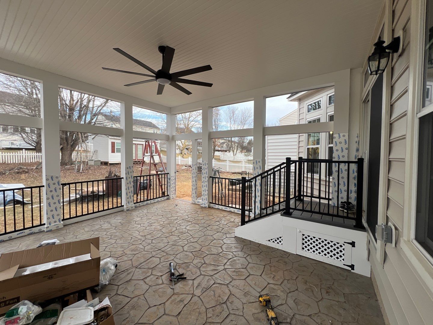 Custom Screened-In Porch with Stamped Concrete Patio in Warrenton by Jakari Restoration & Construction LLC