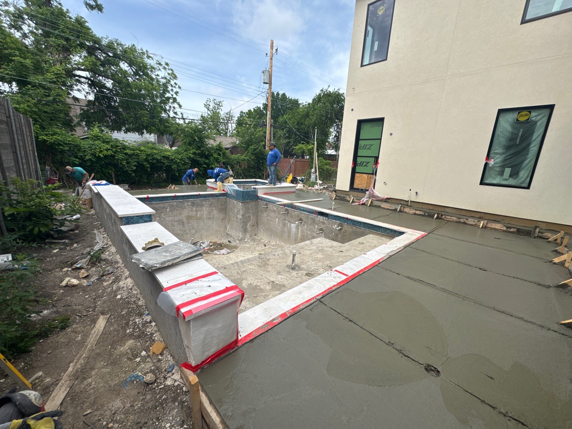 Modern Pool with Raised Glass-Tile Spa by Pinnacle Pools and Spas - DFW