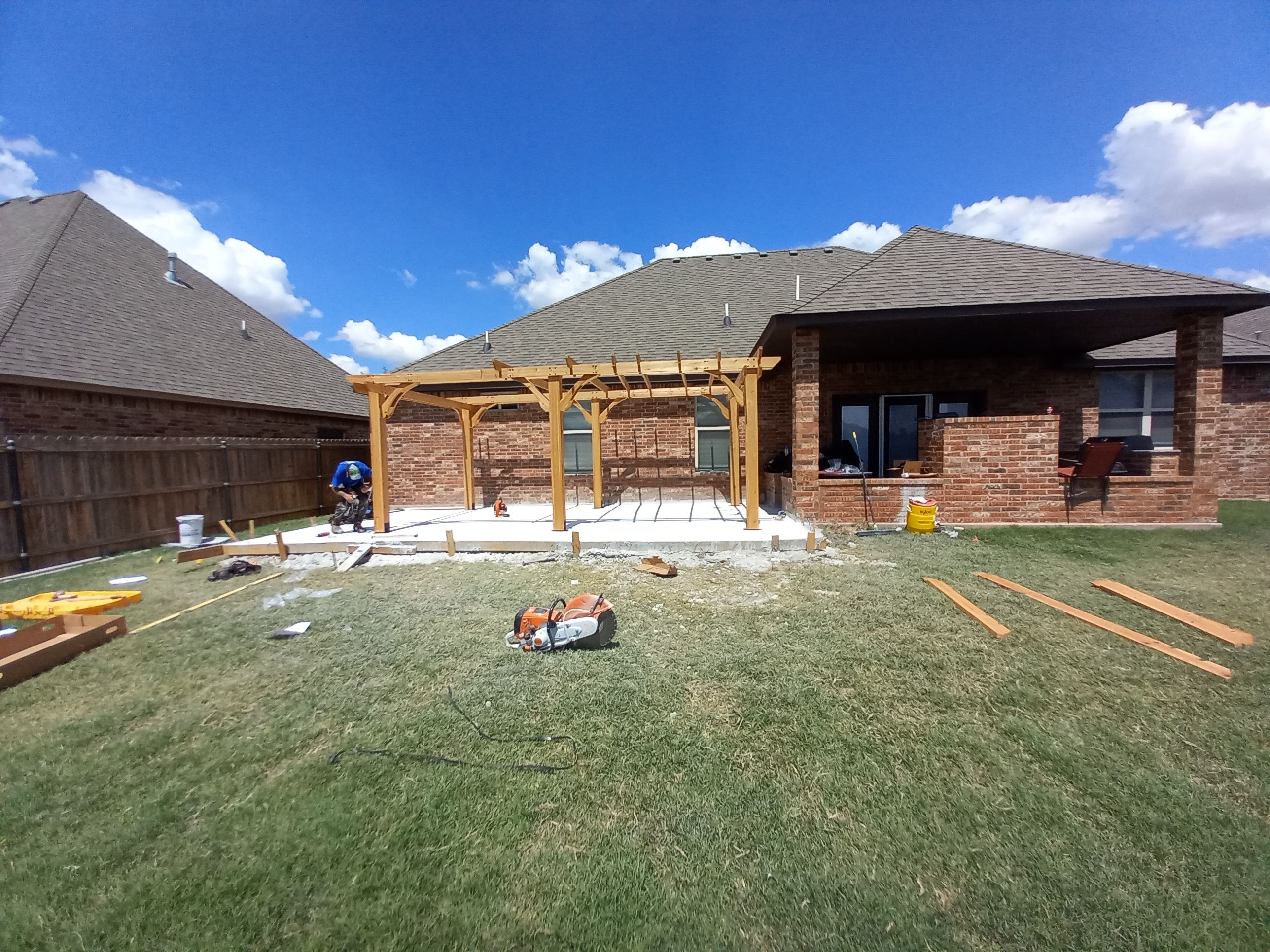 Concrete slab with Pergola by Clays Services Inc