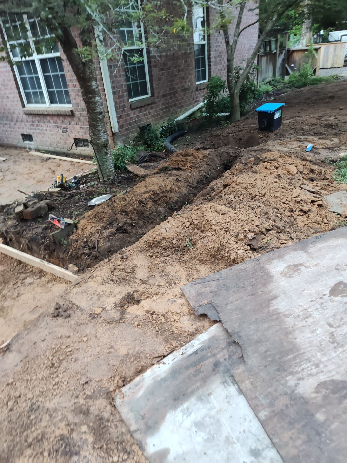 Patio in concrete with drainage improvements by Cornerstone Home Builders, LLC
