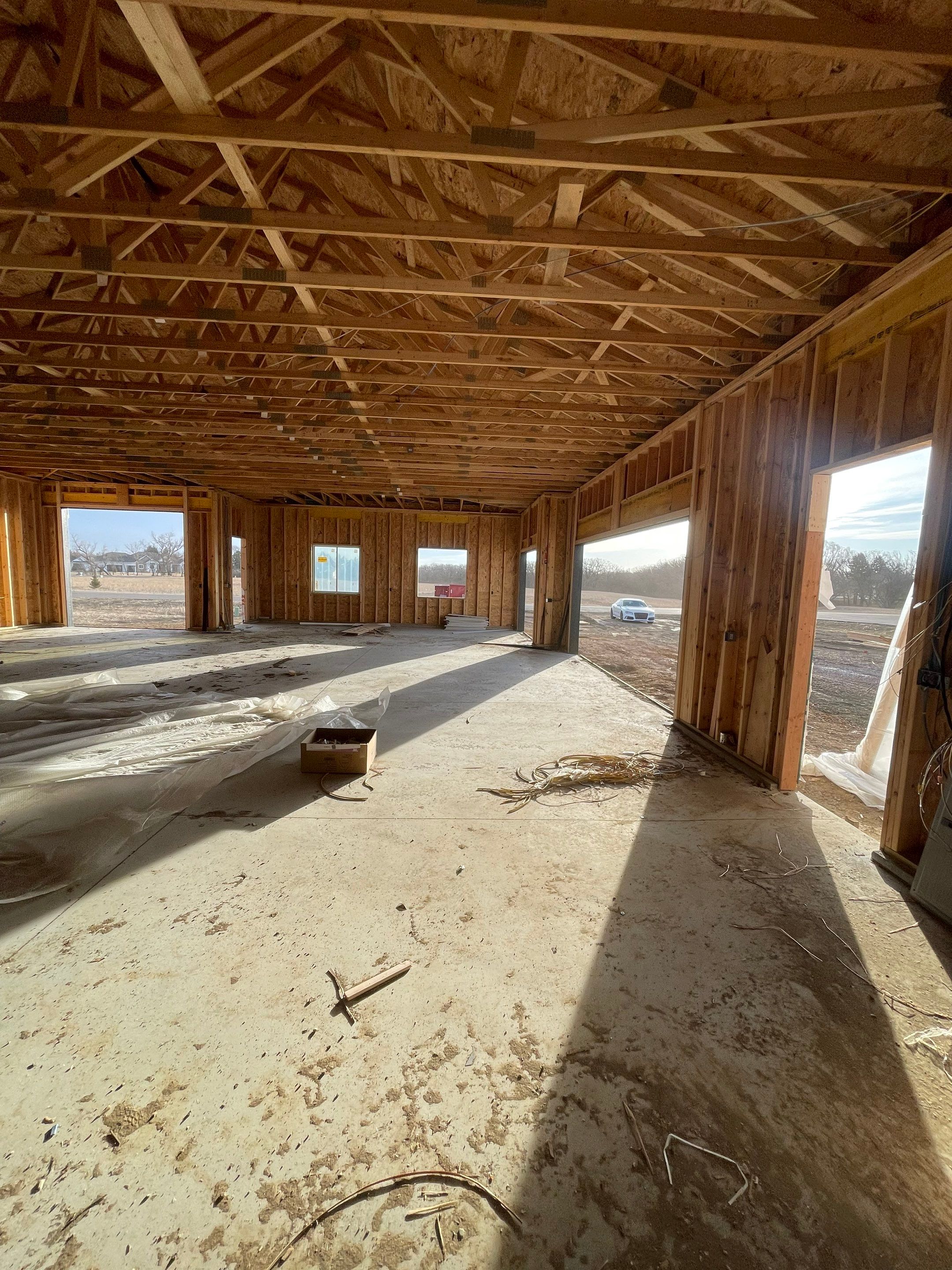 Multi-Bay Garage Concrete Coating and Floor Refinishing in South Dakota by Select Painting, Coatings & Garage Cabinets