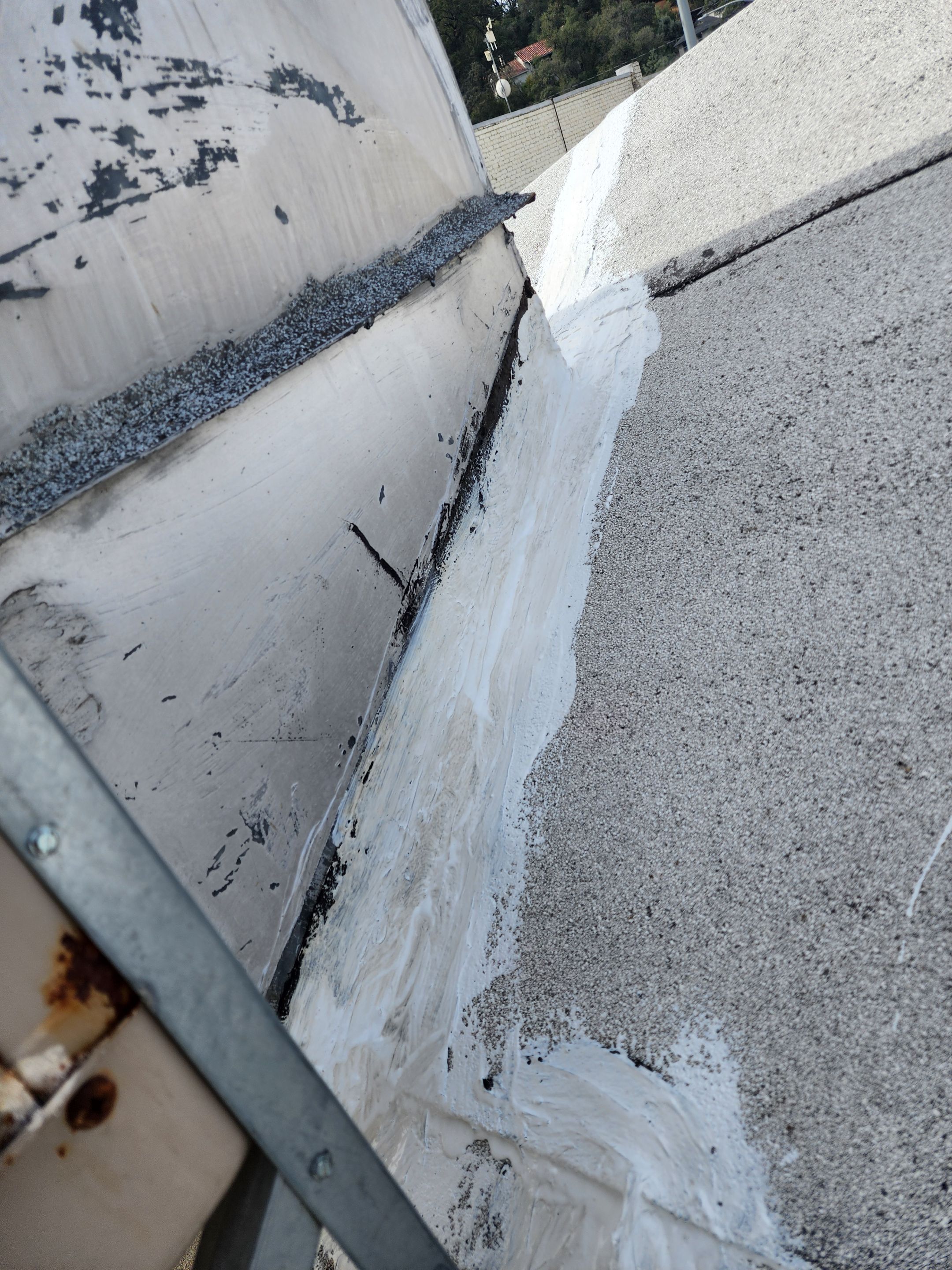 Foam and coatings on commercial roof by Straight Edge Roofing Inc