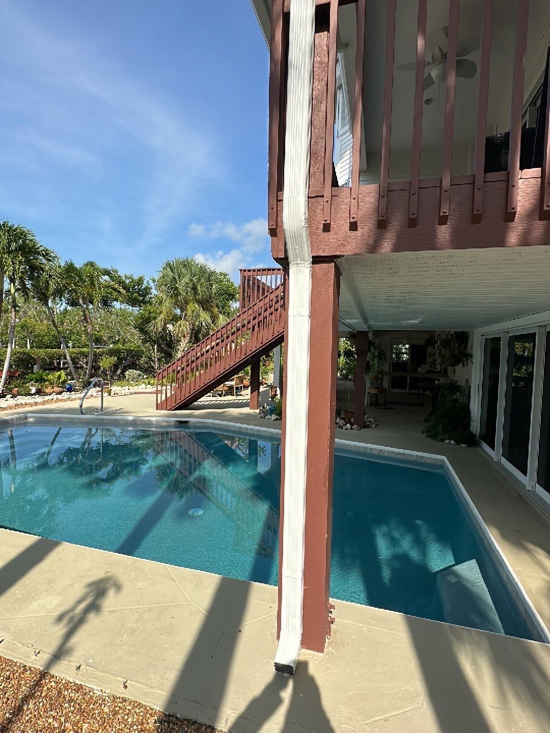 White K-Style Gutters Installed with White Downspouts in Sanibel FL by Gutter Professors