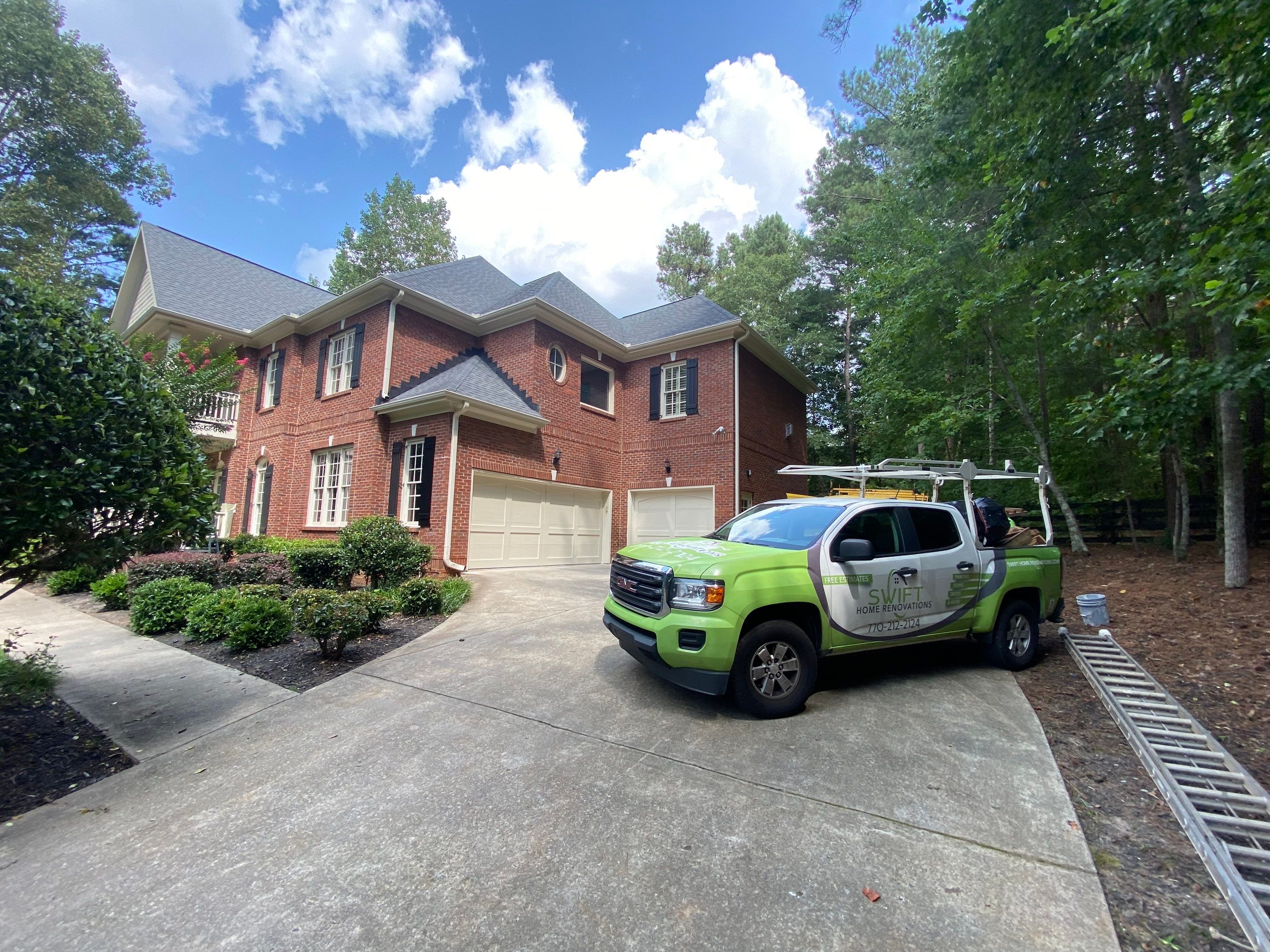 Exterior Trim and Garage Door Painting for Alpharetta Brick Home by Swift Home Renovations