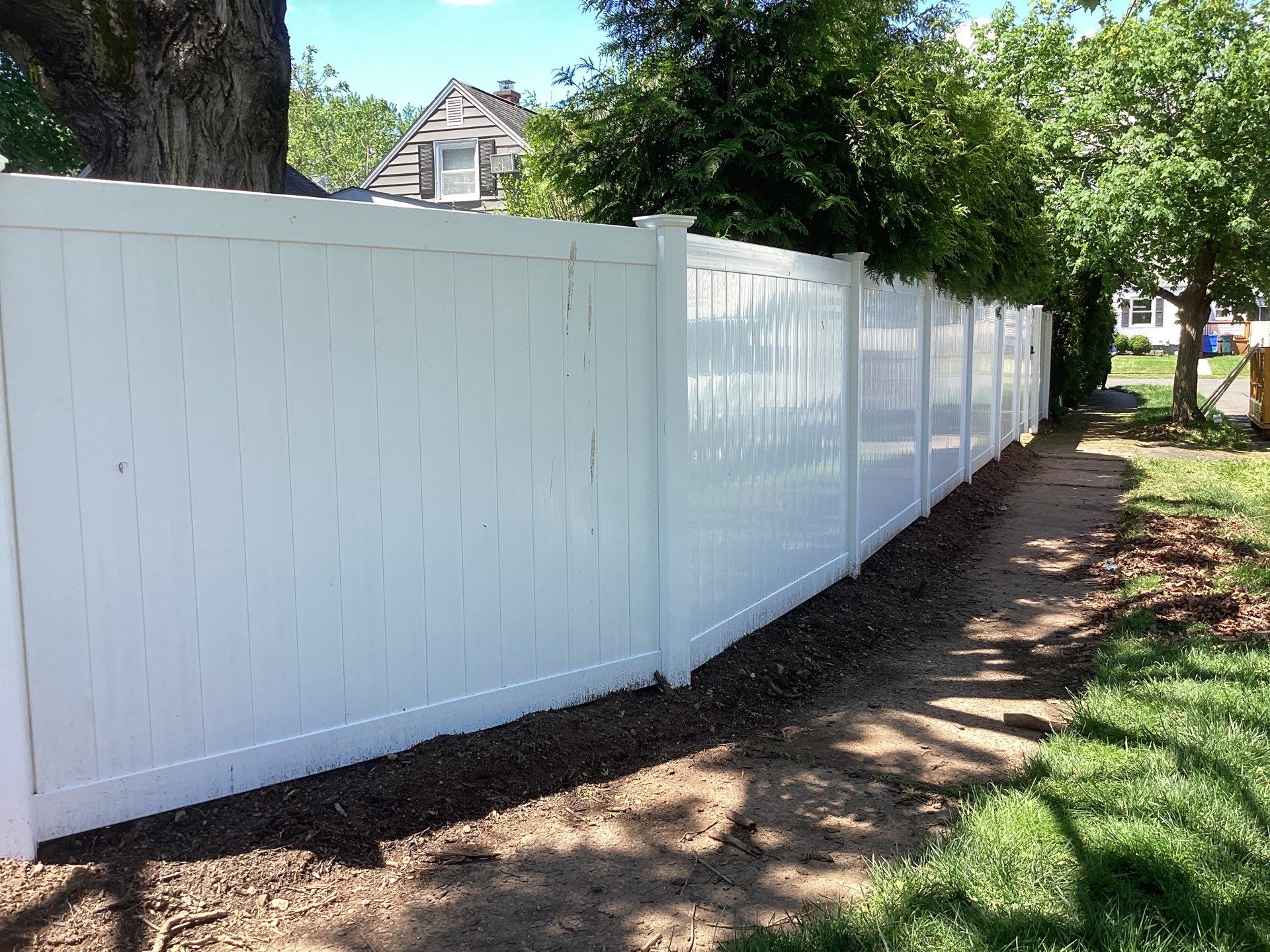 Fence replacement with White Vinyl privacy fence and matching gates  by DiGiorgi Roofing and Siding Inc