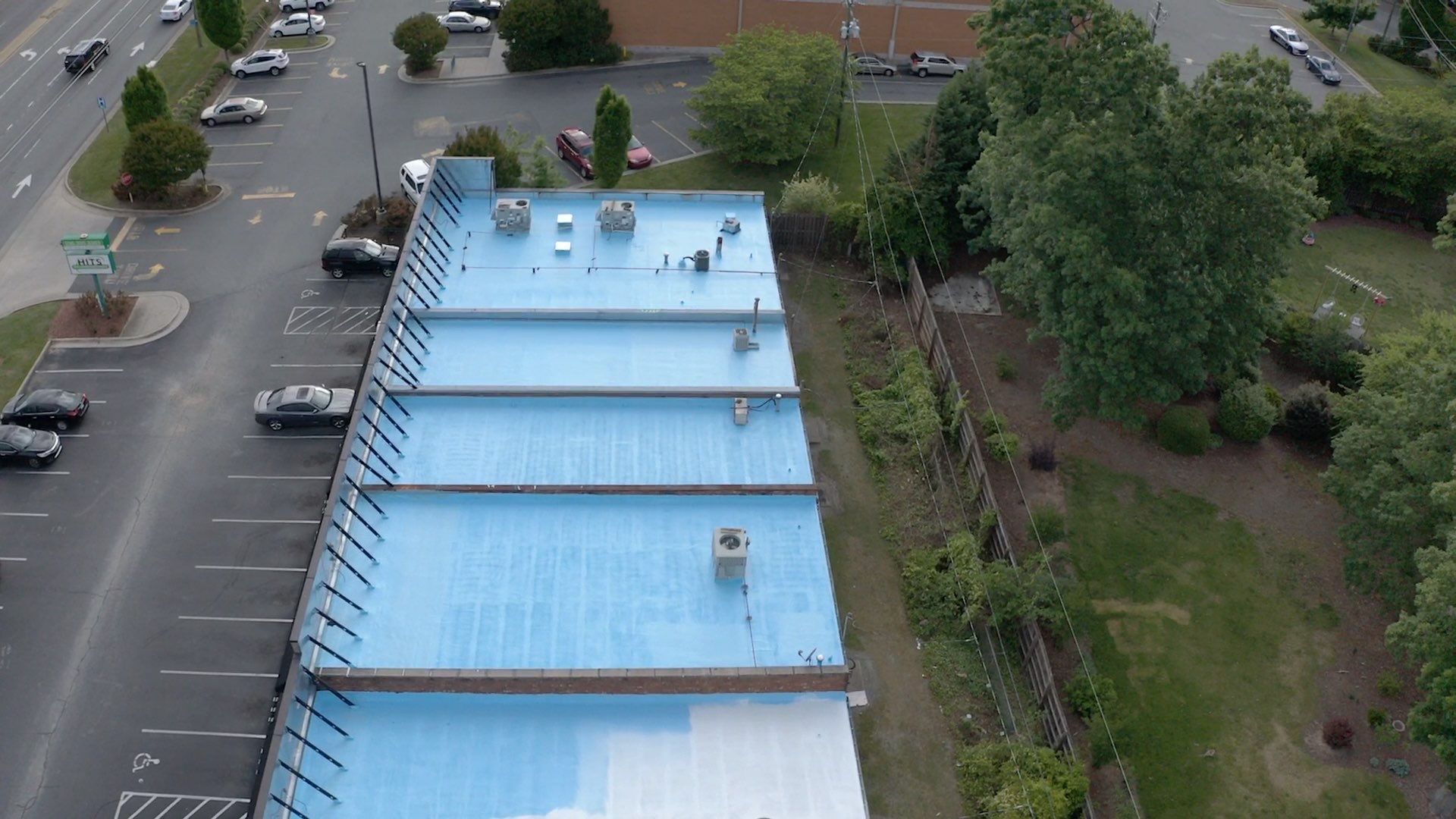 Commercial Roof Coating using Fiberseal basecoat and Silicon Topcoat by Just In Time Roofing and Restoration