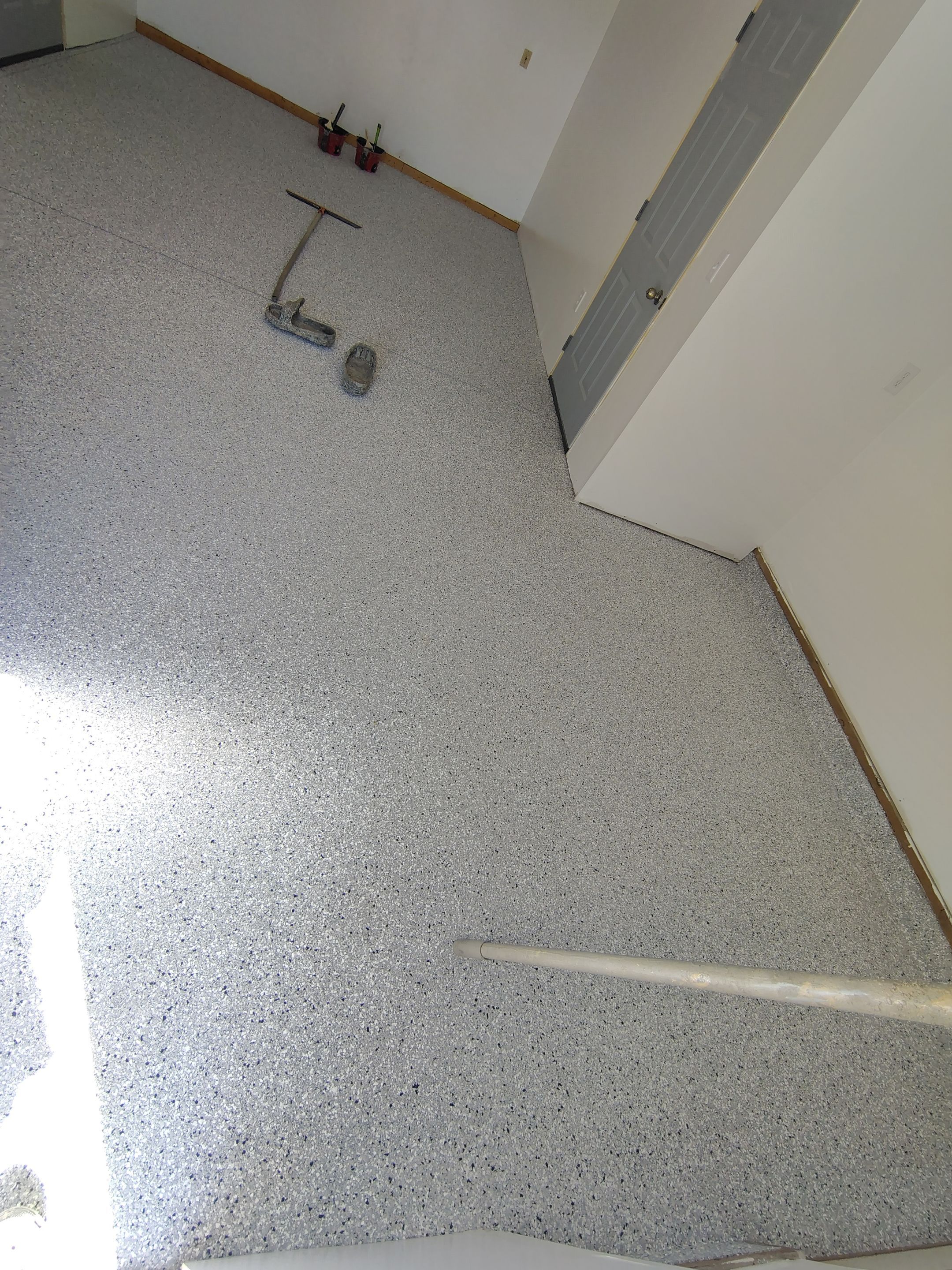 Decorative Chip Concrete Coating Installation in Luverne by Select Painting, Coatings & Garage Cabinets