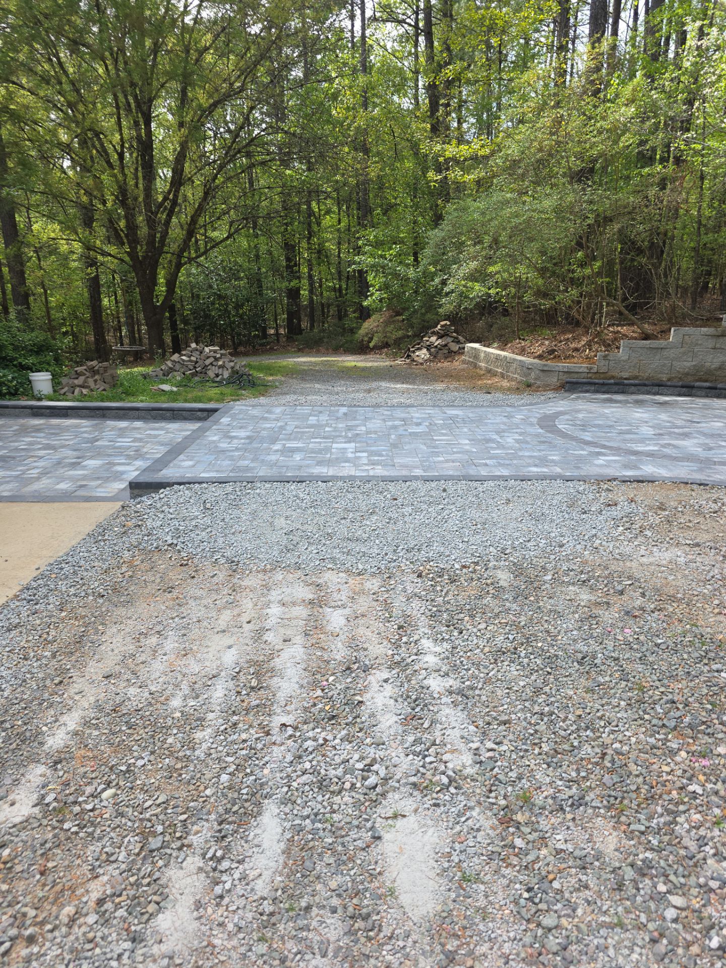 Pittsboro Outdoor Living Transformation – Retaining Wall, Paver Patio & Elevated Deck by Elite Remodeling and Design LLC