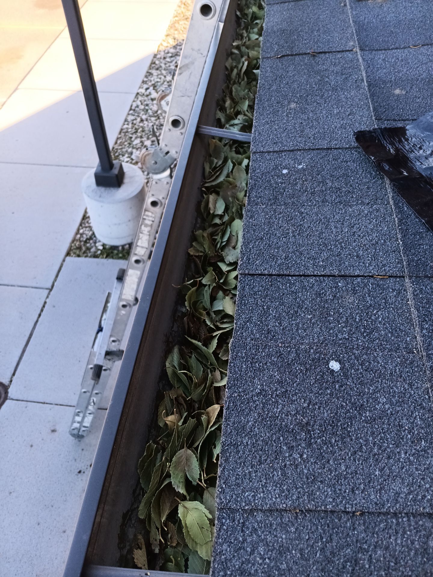 Commercial gutter cleaning Wyoming before photo with filled gutters
