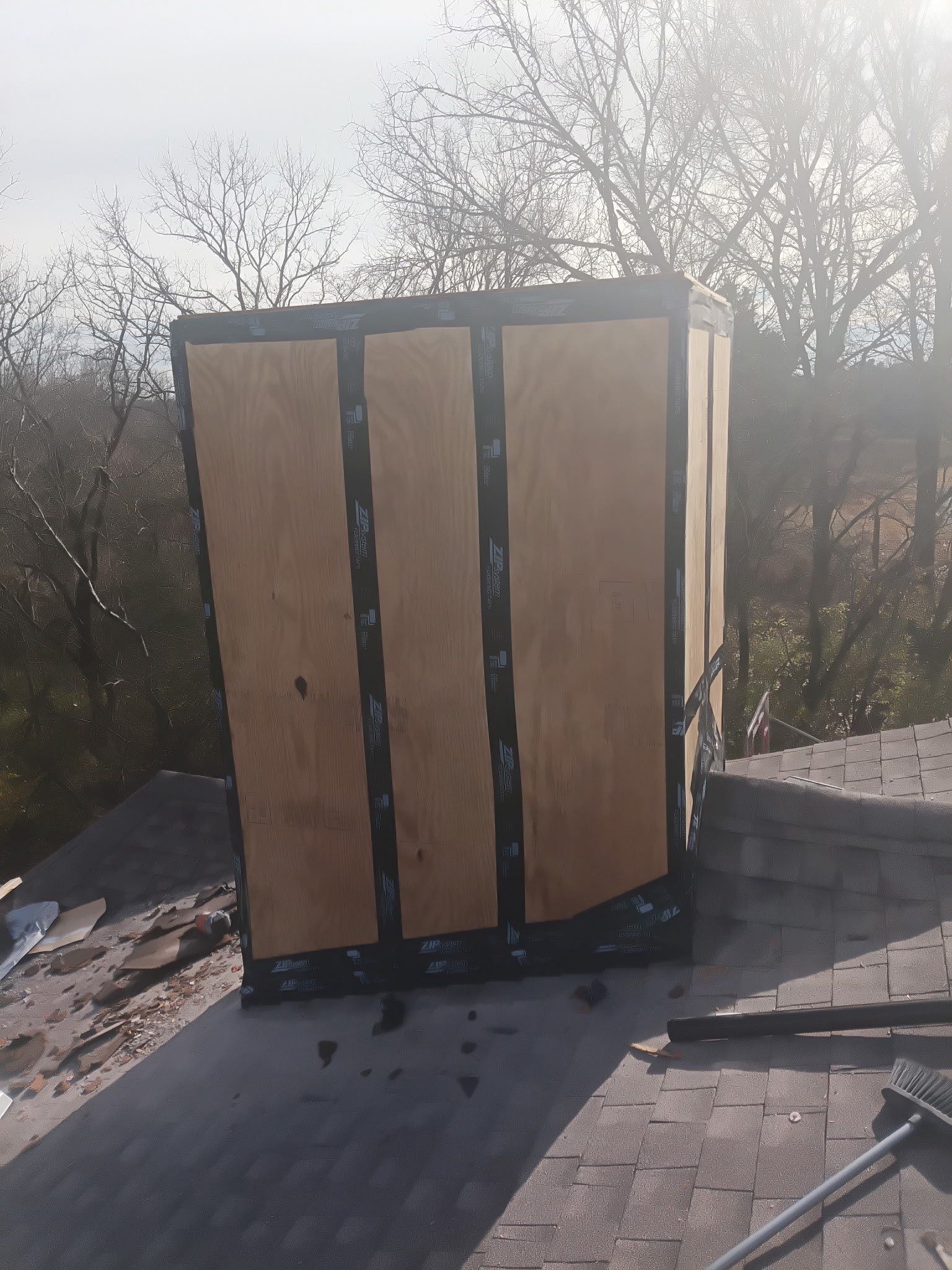 Roof and Gutter System Replacement with Stone Chimney Rebuild by Undersun Roofing 