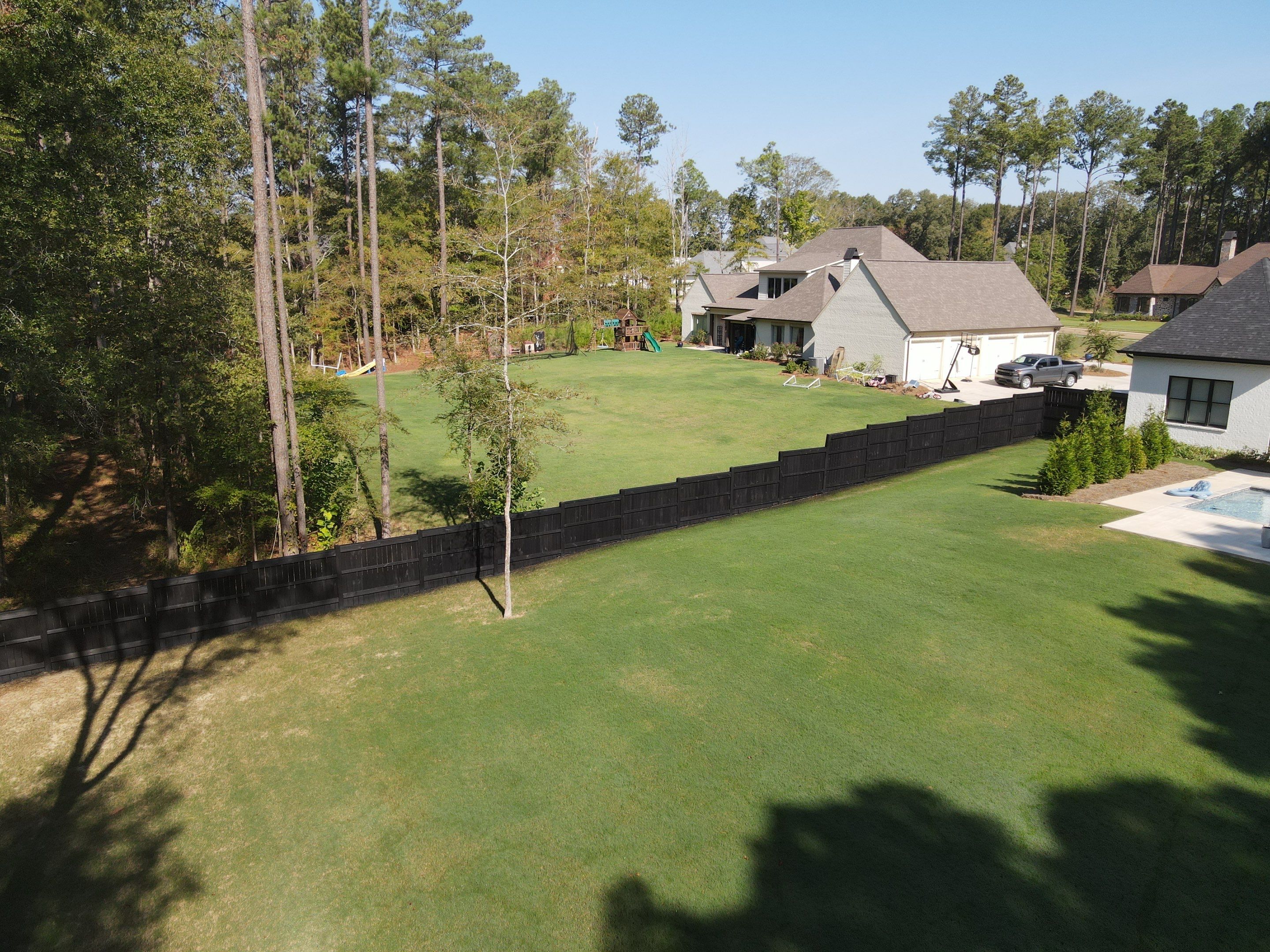 Fence Stain using Wood Defender Black  by Roberson Construction LLC