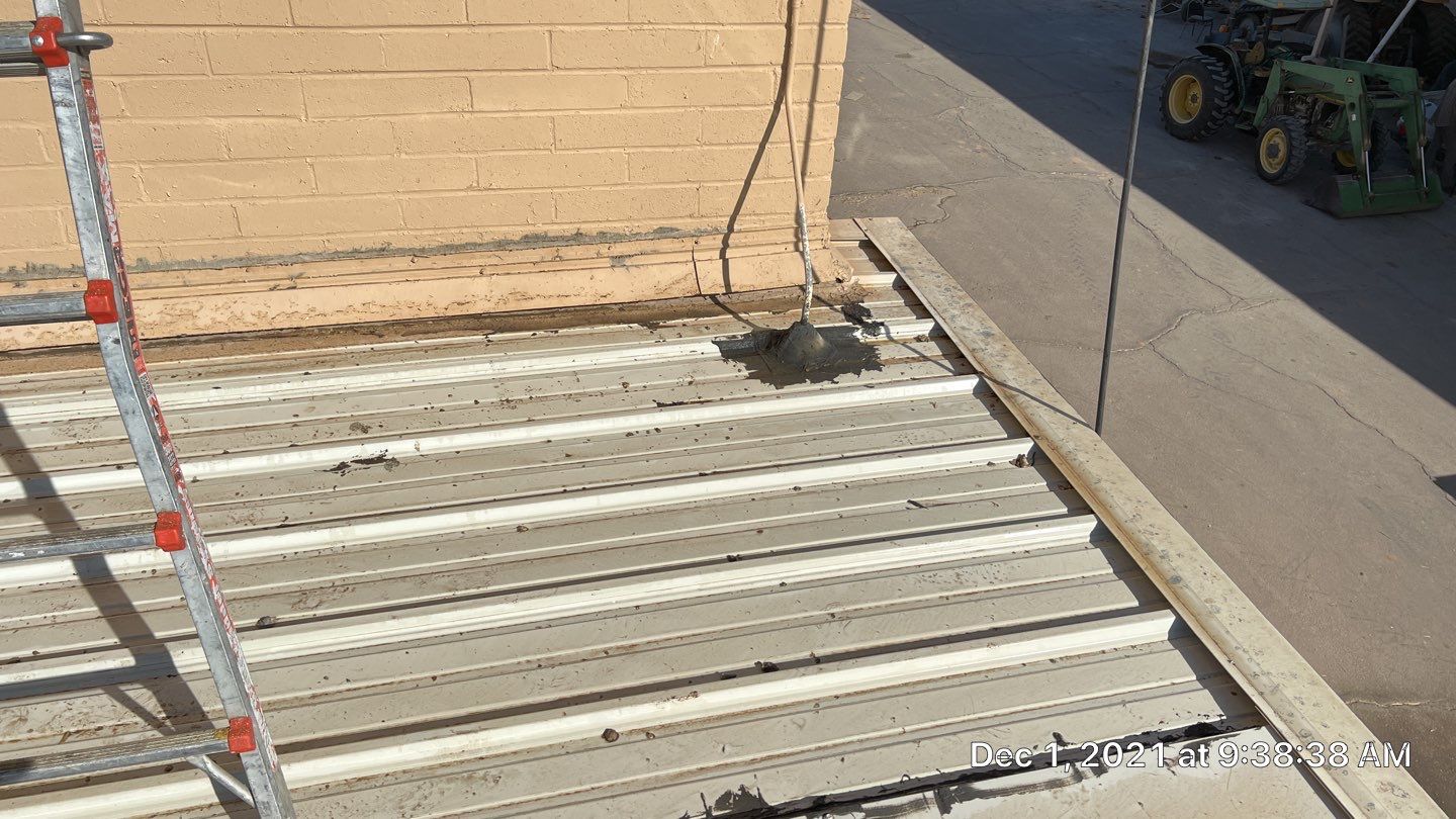 Metal roof restoration on commercial roof using Conklin Benchmark/PUMA XL fabric and coating by Straight Edge Roofing Inc