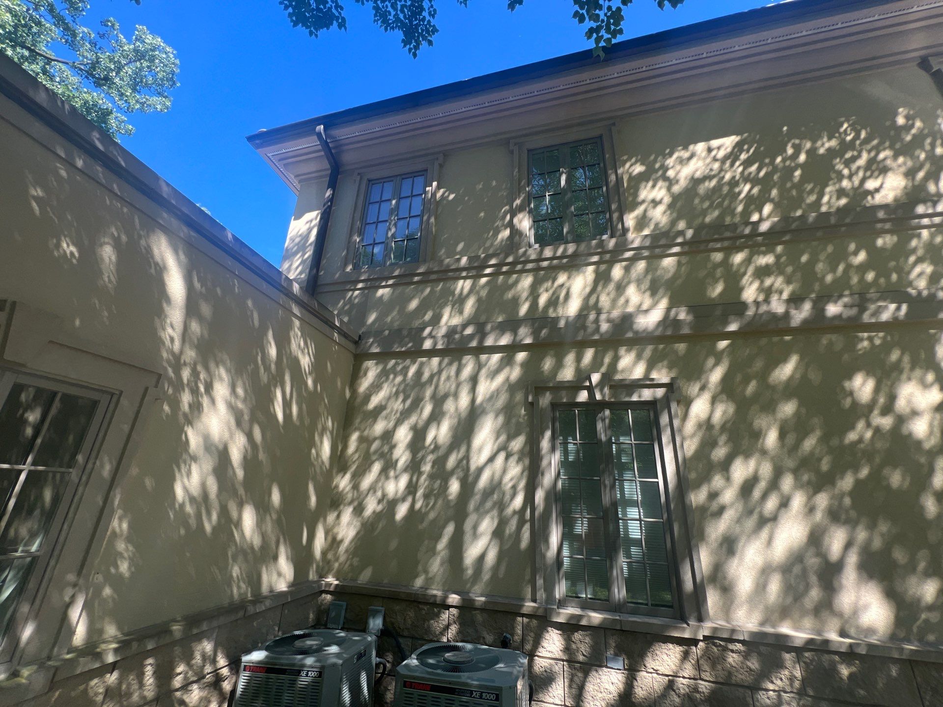 concrete cleaning using Algaecide, soft wash soap by Northern Power Washing LLC.