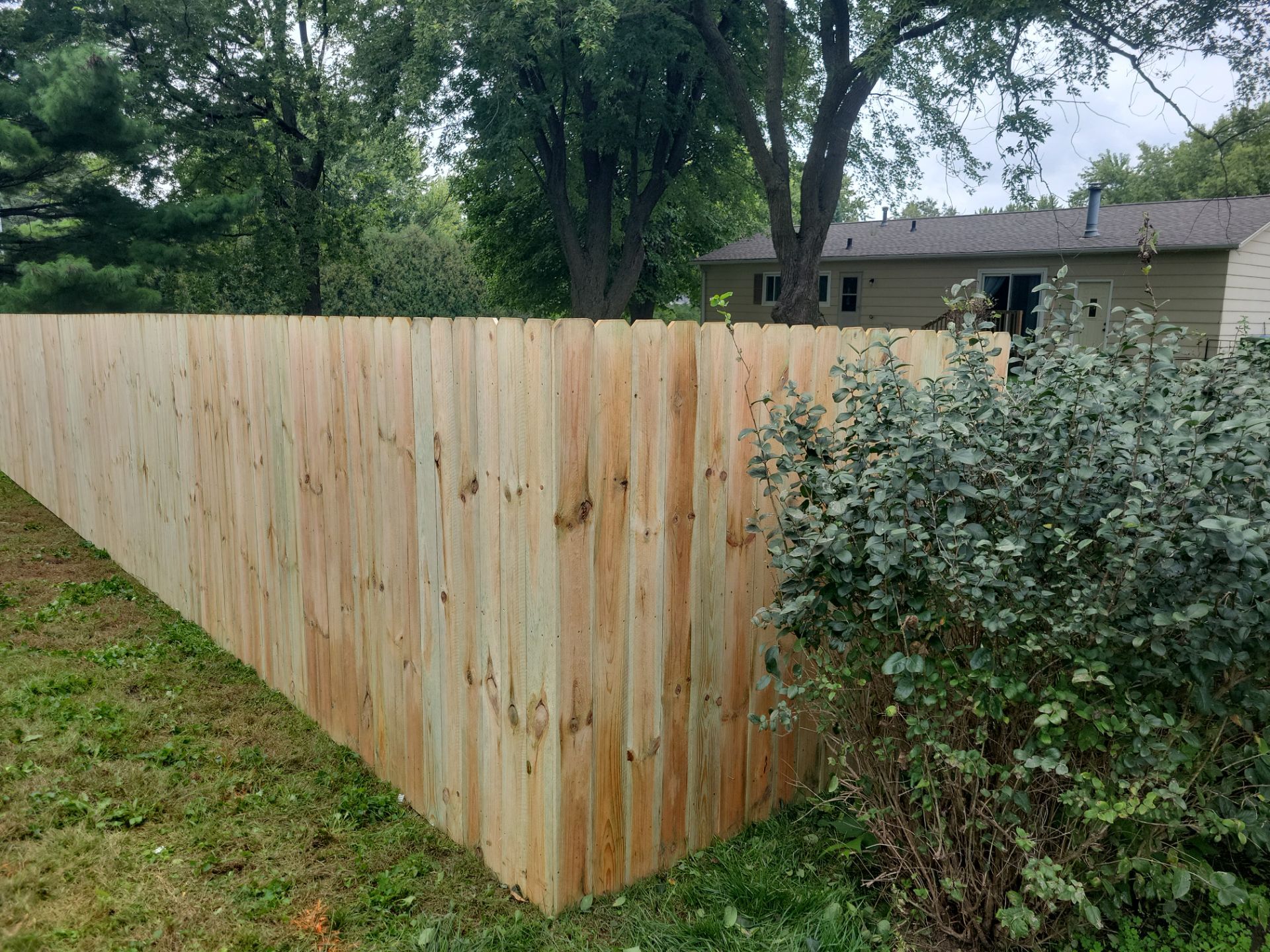 Pressure-Treated Wood Privacy Fence Installation in Waverly by Perfect Picket Fence and Stain