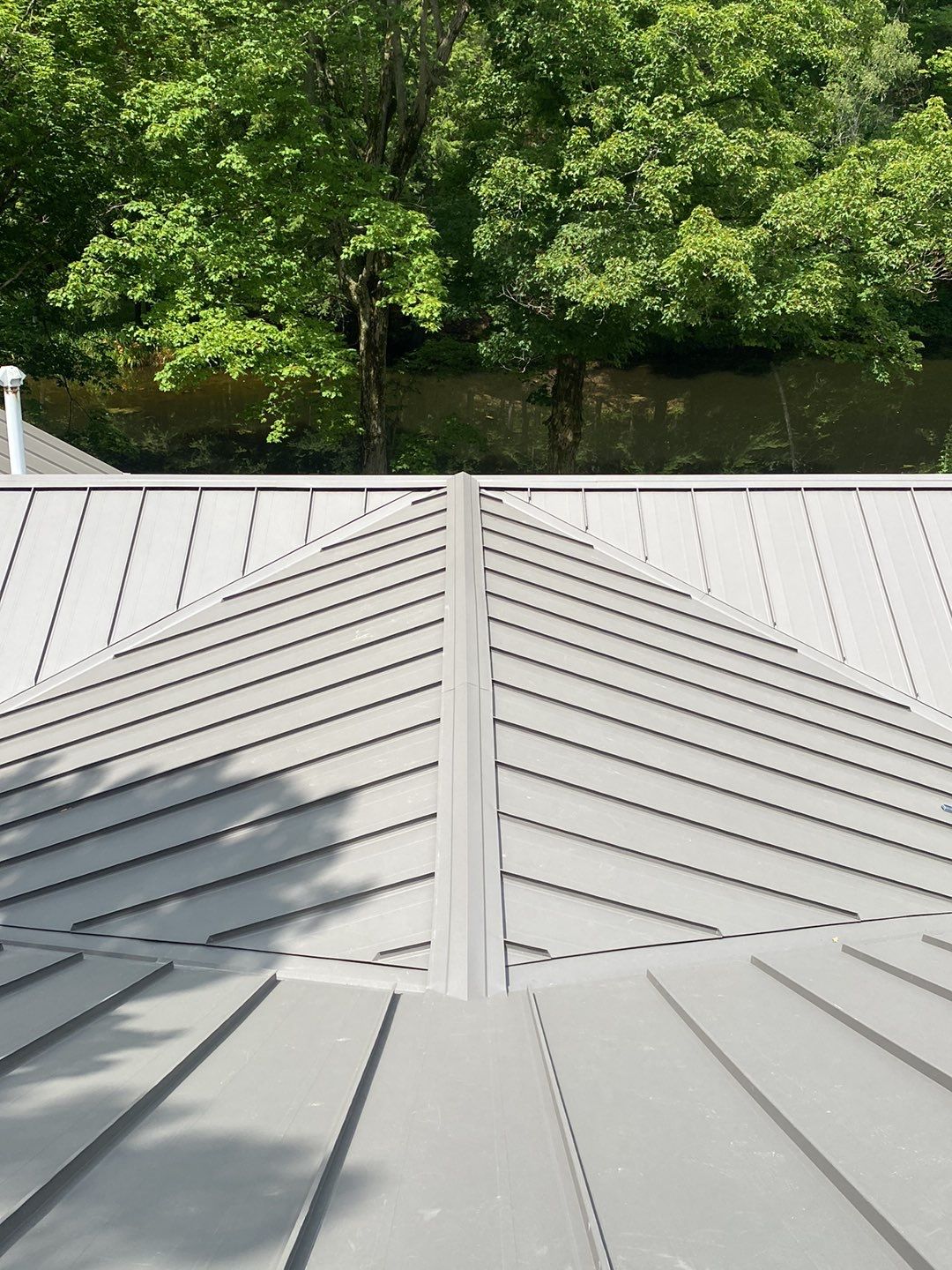 Residential Roofing Installation using 24 Ga Standing Seam Meta by Jay Carter Roofing & Sheet Metal