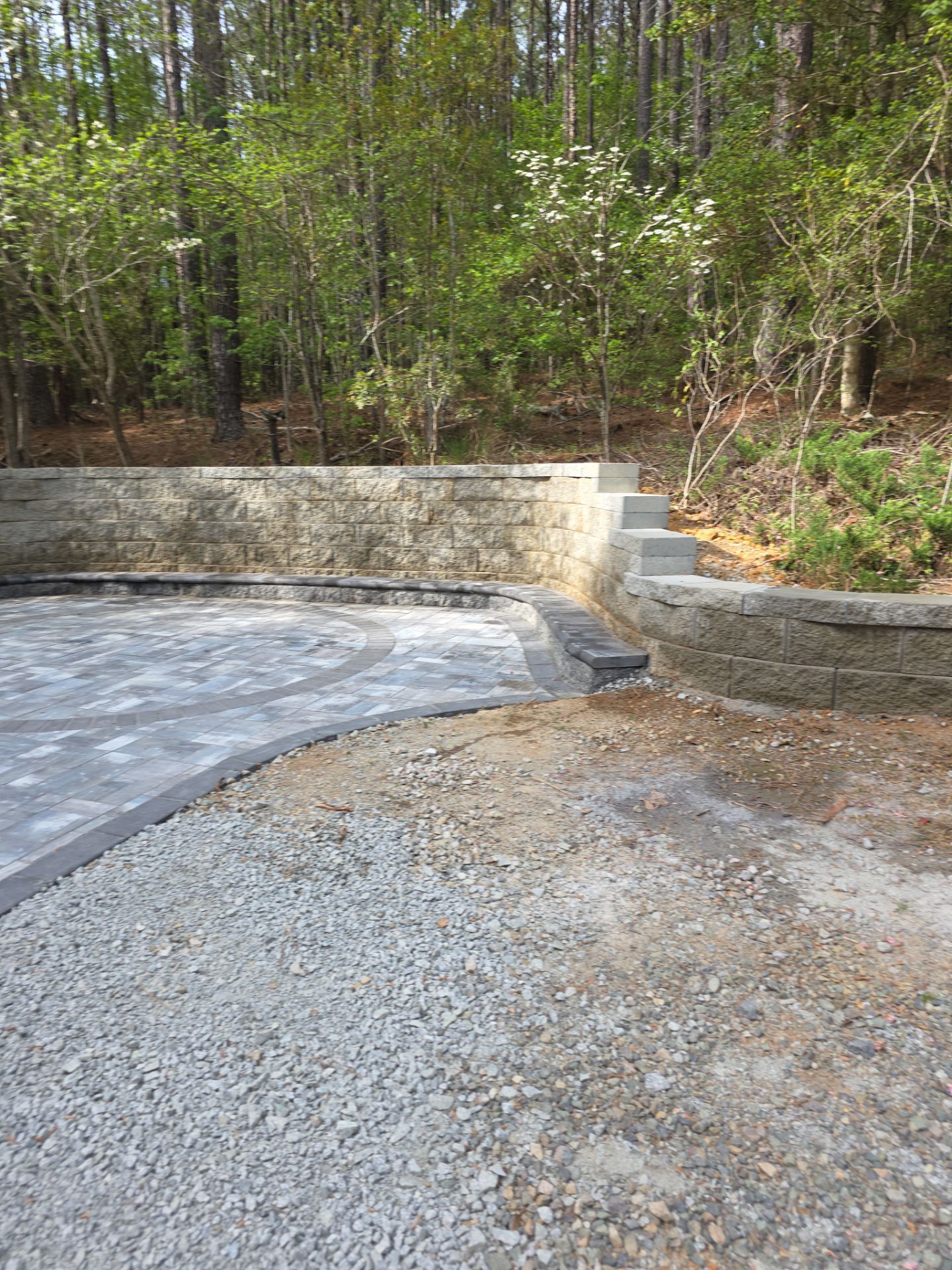 Pittsboro Outdoor Living Transformation – Retaining Wall, Paver Patio & Elevated Deck by Elite Remodeling and Design LLC
