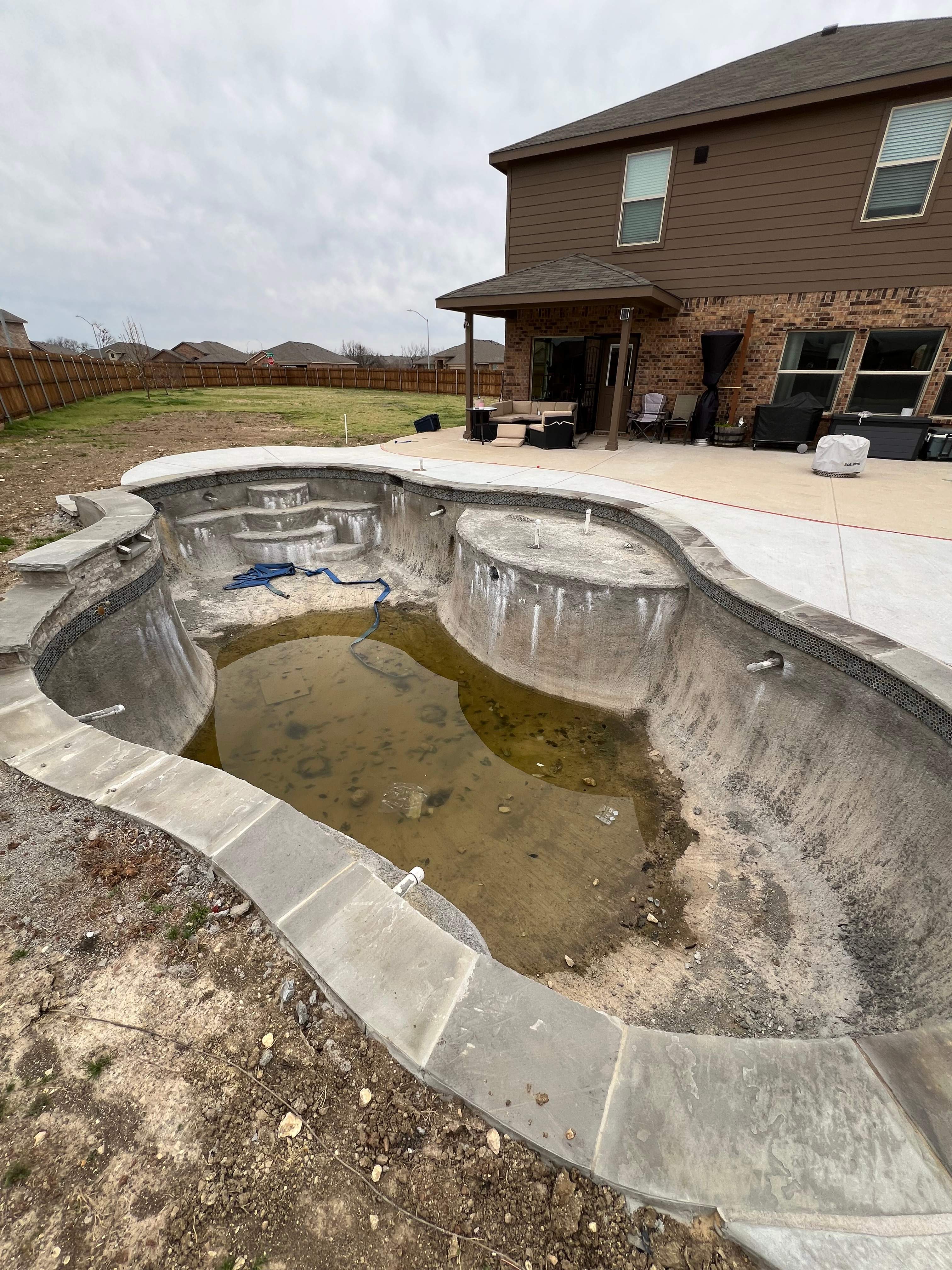 Freeform Pool with Sun Shelf by Pinnacle Pools and Spas - DFW