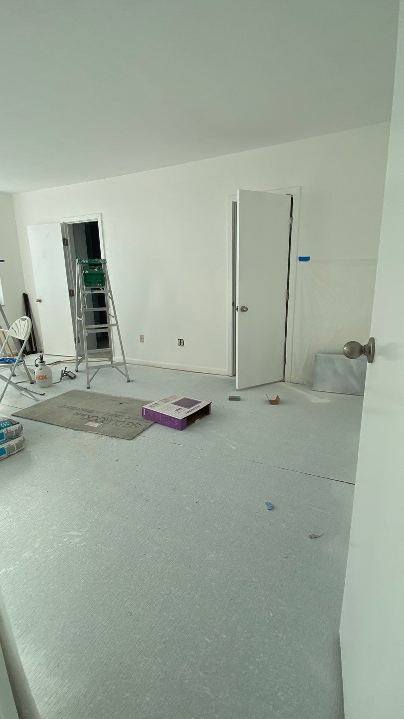 Apartament renovation  using Harwood floor  by Jesus Master Handyman LLC 