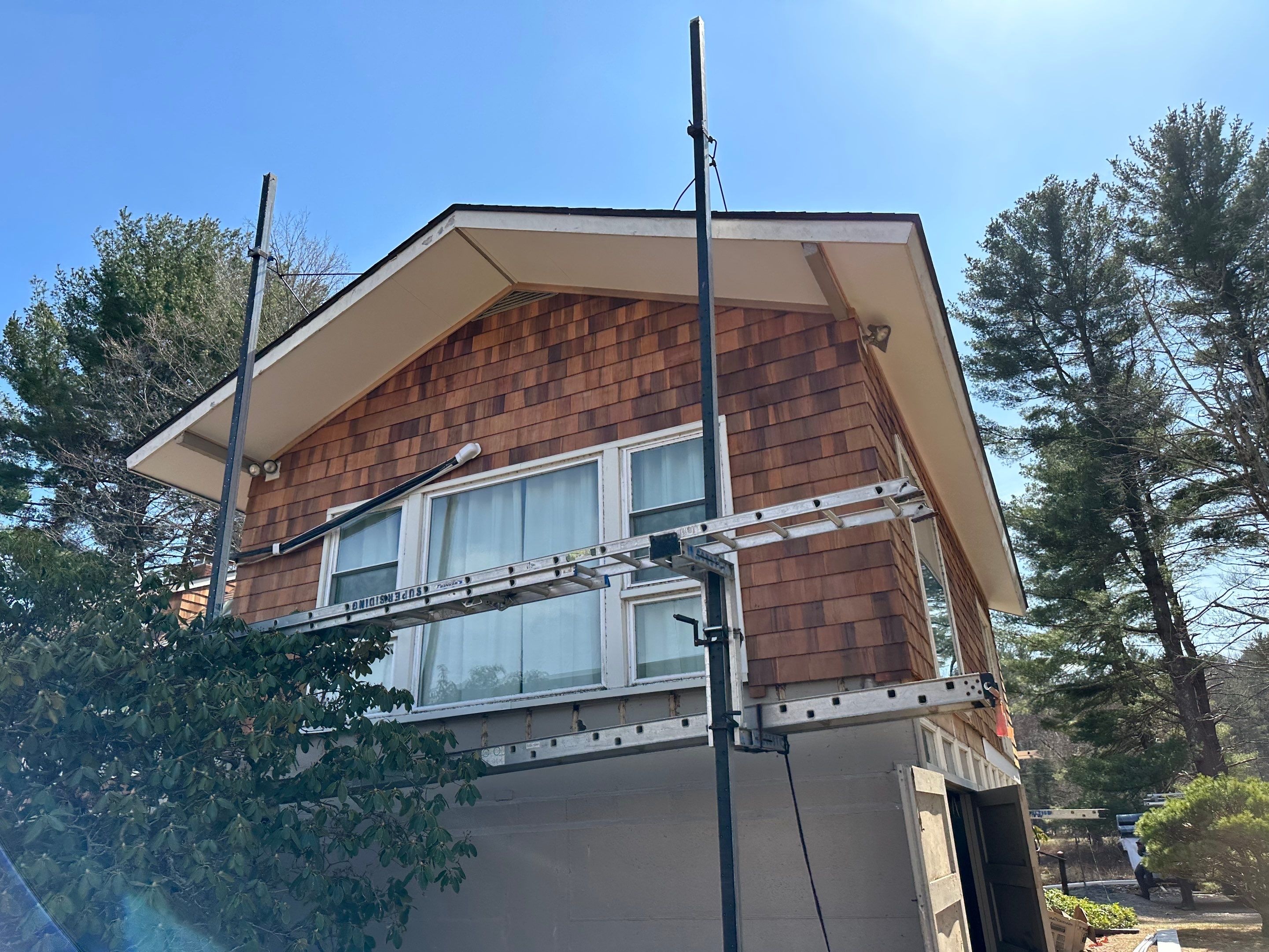 Siding Installation using Perfection Red Western Cedar Shingles  by Loyalty Exterior Solutions 