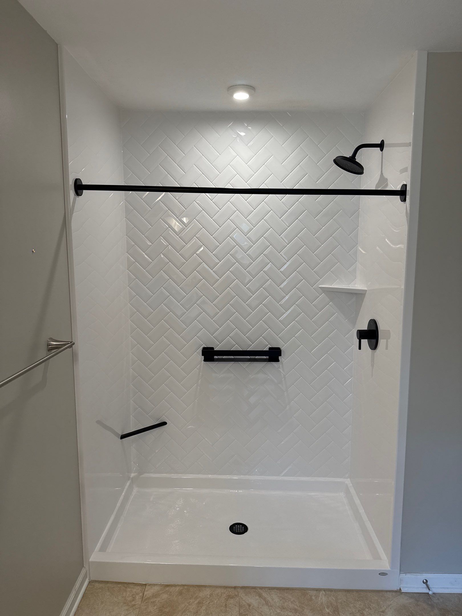Custom Jacuzzi Walk-In Shower Remodel with Stone-Look Tile in Traverse City by Rainbow Seamless Systems