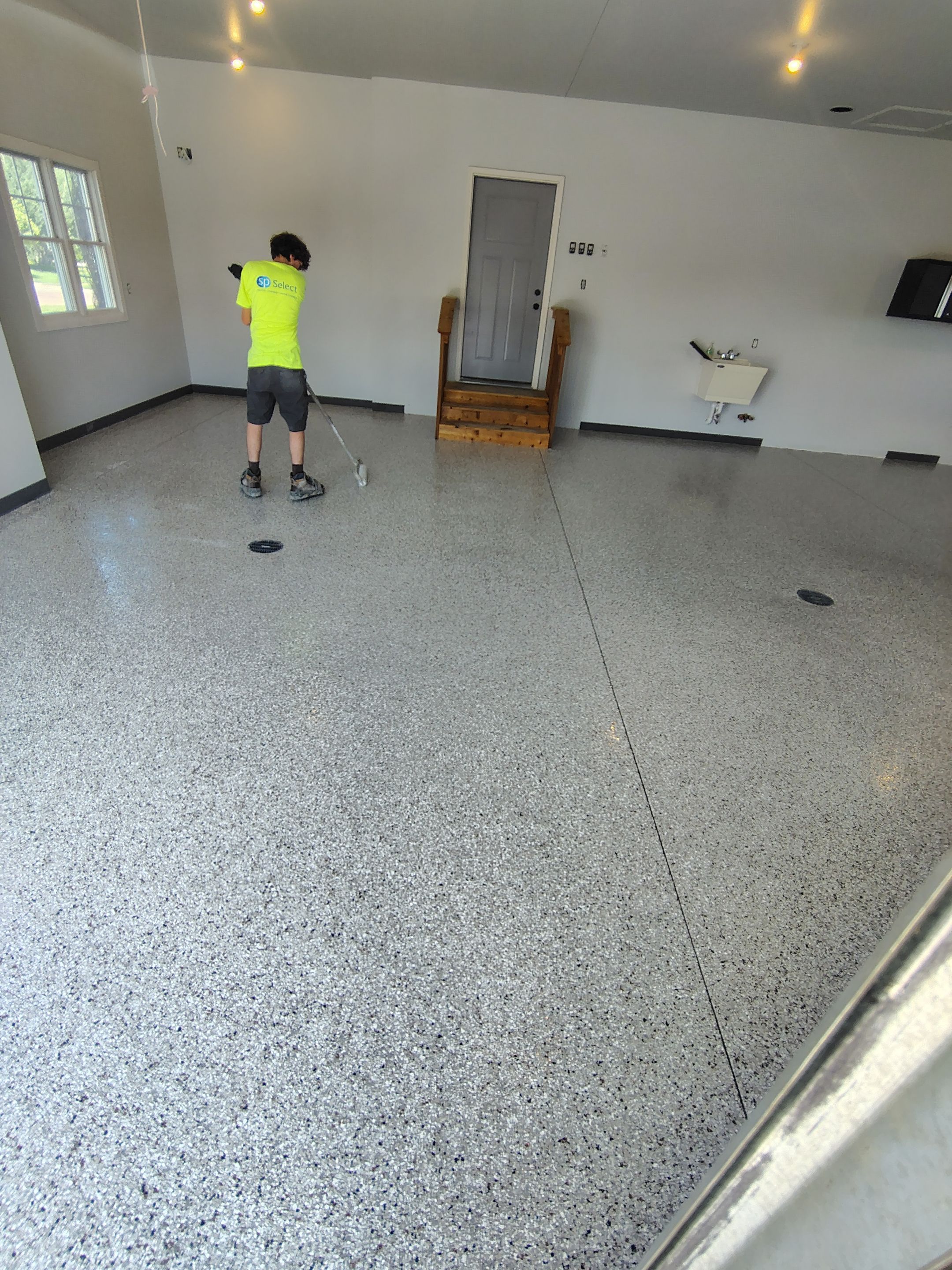 Multi-Car Garage Concrete Coating and Crack Repair in Dell Rapids by Select Painting, Coatings & Garage Cabinets