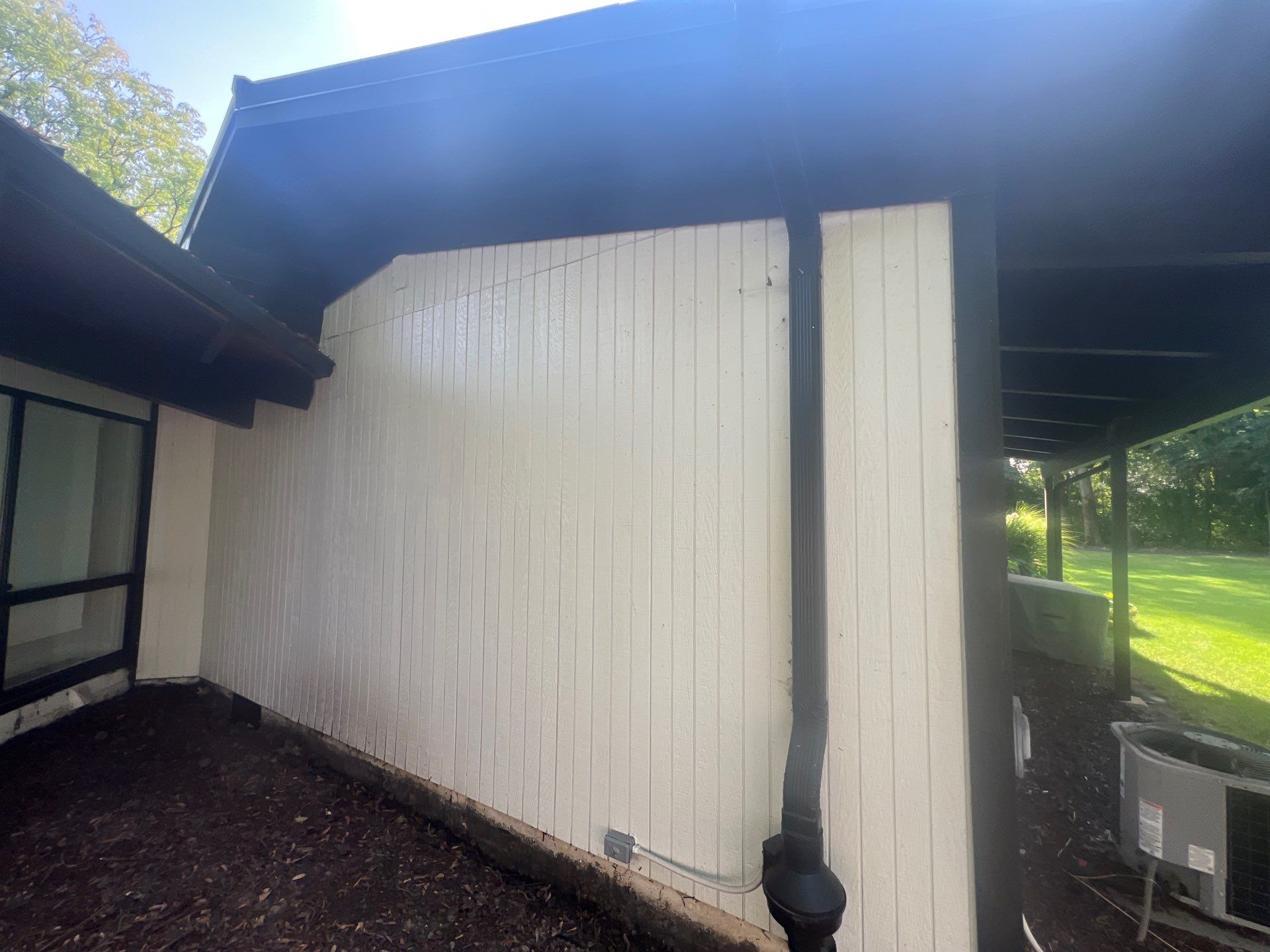 Complete Exterior House, Bluestone & Garage Floor Cleaning by Northern Power Washing LLC.