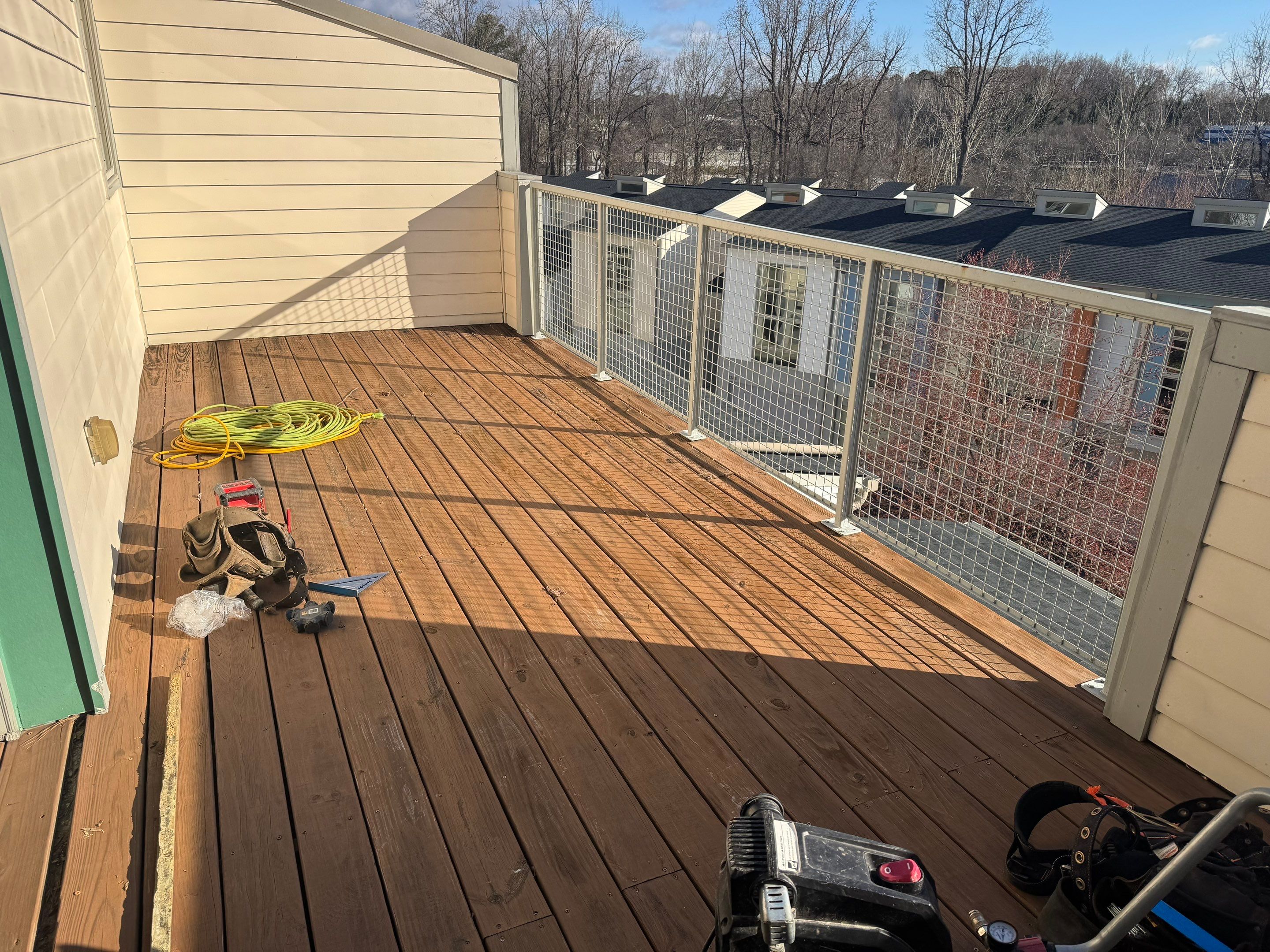 Atlanta Elevated Pressure-Treated Deck Installation With Mesh Railings by Swift Home Renovations 