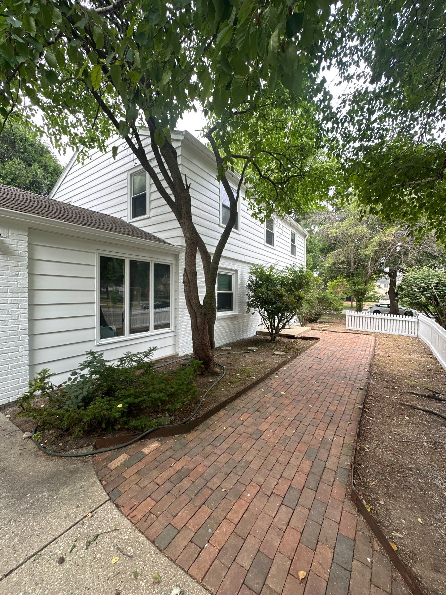 Shorewood Exterior Painting and Siding Refresh With Contrast Trim by OCS Contracting Services