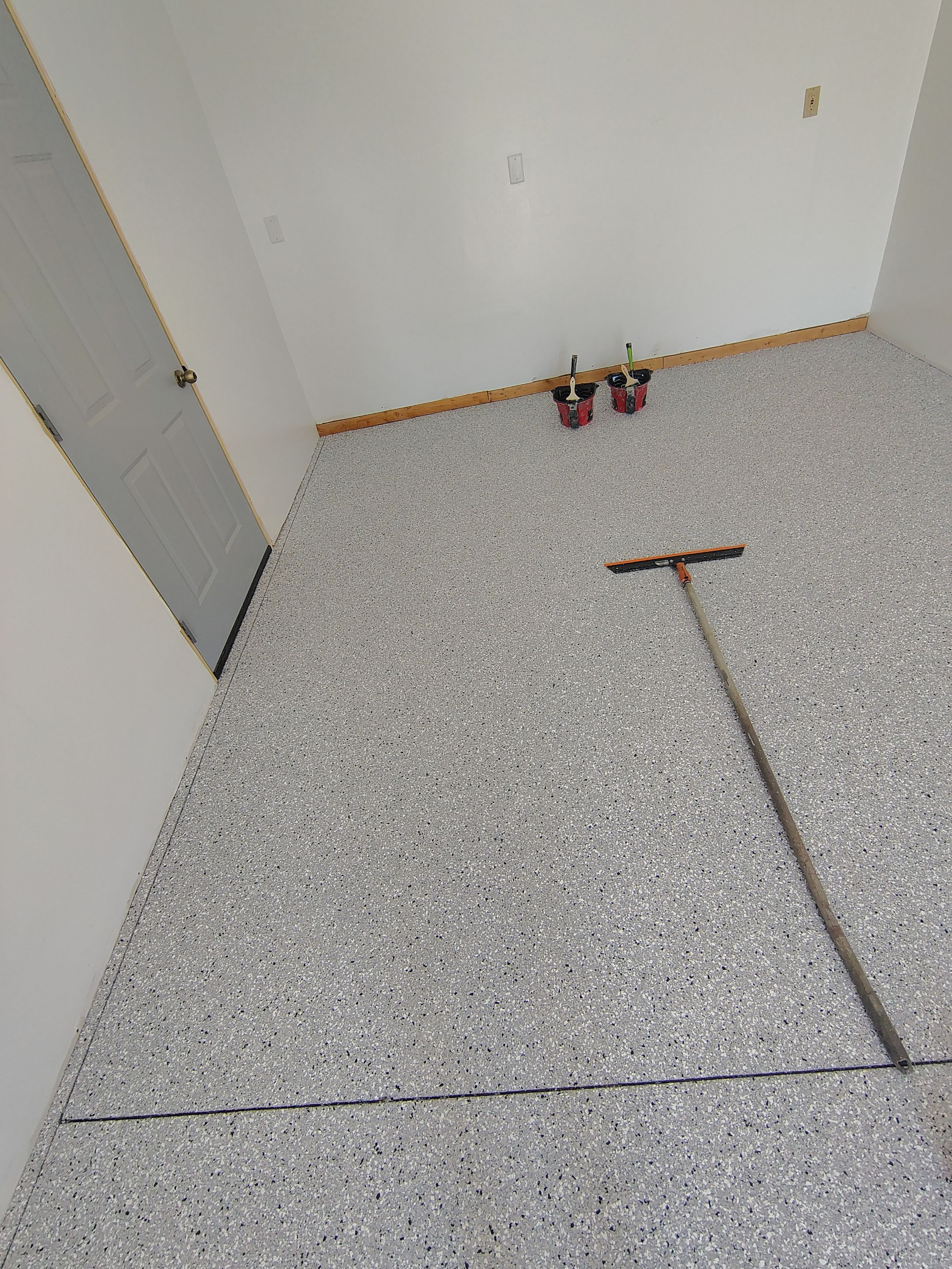 Decorative Chip Concrete Coating Installation in Luverne by Select Painting, Coatings & Garage Cabinets