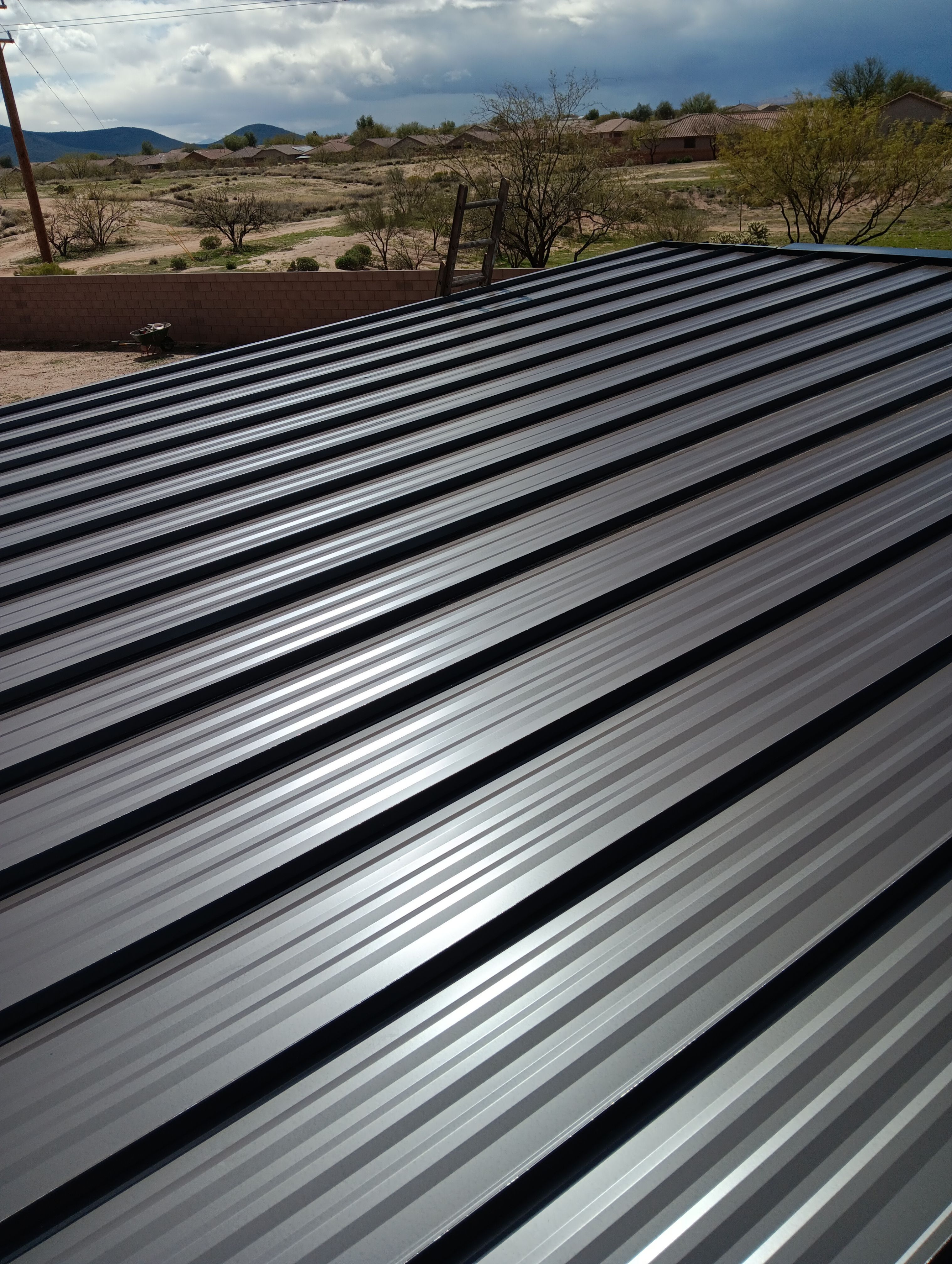 Dark Bronze Standing Seam by Reimagine Roofing